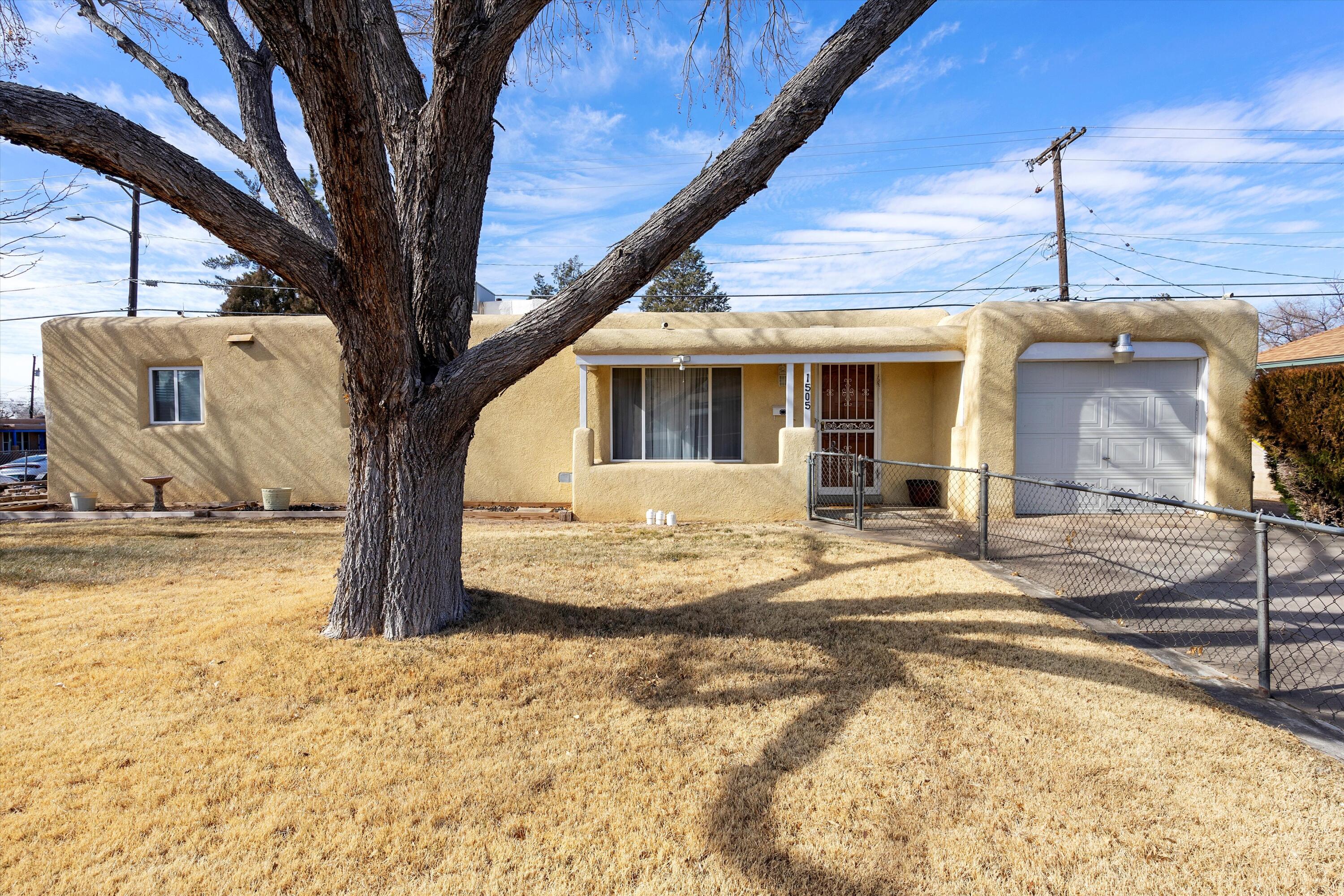 Welcome to this charming and well-maintained 3-bedroom home, perfectly situated just minutes from shopping, dining, and easy access to I-40. Inside, you'll find a warm and inviting floor plan, featuring hardwood flooring in the kitchen and dining area, stainless steel appliances, and an updated bathroom with beautiful travertine tile. Enjoy year-round comfort with refrigerated air, while the added exterior insulation helps improve energy efficiency and lower utility costs. Don't miss this fantastic opportunity to own a home that combines convenience, comfort, and thoughtful updates!