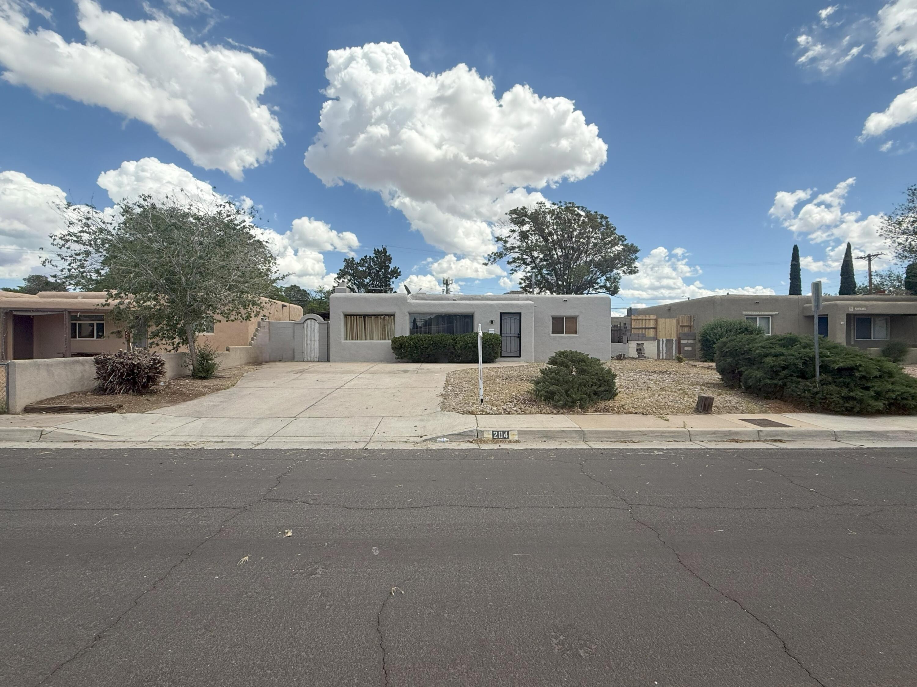 This well-maintained 3-bedroom, 2-bathroom home features a blend of traditional charm and recent improvements. Interior updates include fresh paint, a new elastomeric coating on the stucco exterior, and a new sliding glass door that opens to the covered patio.The interior offers a warm living area with a wood-burning kiva fireplace and a kitchen equipped with stainless steel appliances. The home also features a spacious walled backyard providing space for outdoor enjoyment.Conveniently located near Expo NM, shopping centers, restaurants, parks, and major thoroughfares, this property provides accessible living.Schedule your tour today!