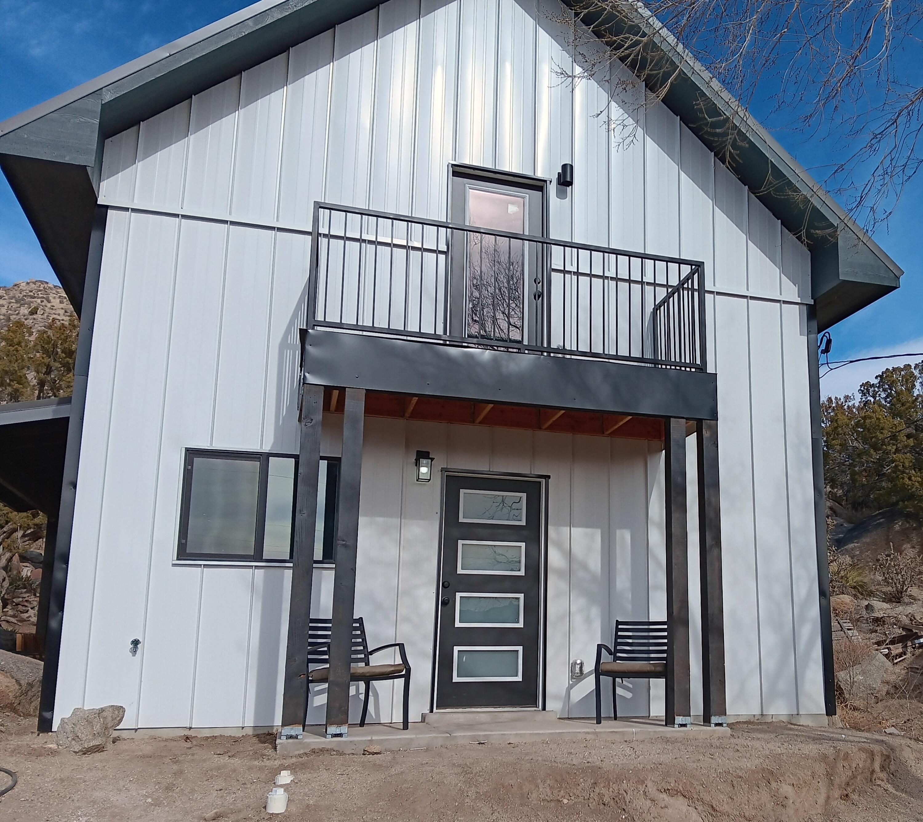 This is an Amazing, 2bed room 2 bath Modern A-frame style single family home. The main level has an open kitchen with shaker cabinets, quartz top a free-standing range oven, and a 6 foot island with butcher block top, there is a large dining area directly off the kitchen. Also the living room is adjacent with tons of windows and 2 separate covered patios off the living area. There is a 3rd covered porch off the front entry door, there is a 3/4 bathroom and a large closet on the 1st floor, the second floor has 2 bedrooms each has its private deck. both have walk-in closets. The bathroom has a soaking tub 2 sink vanity and a separate enclosed shower. the outside living areas make you feel like you are in the mountains. On the same property we have a --