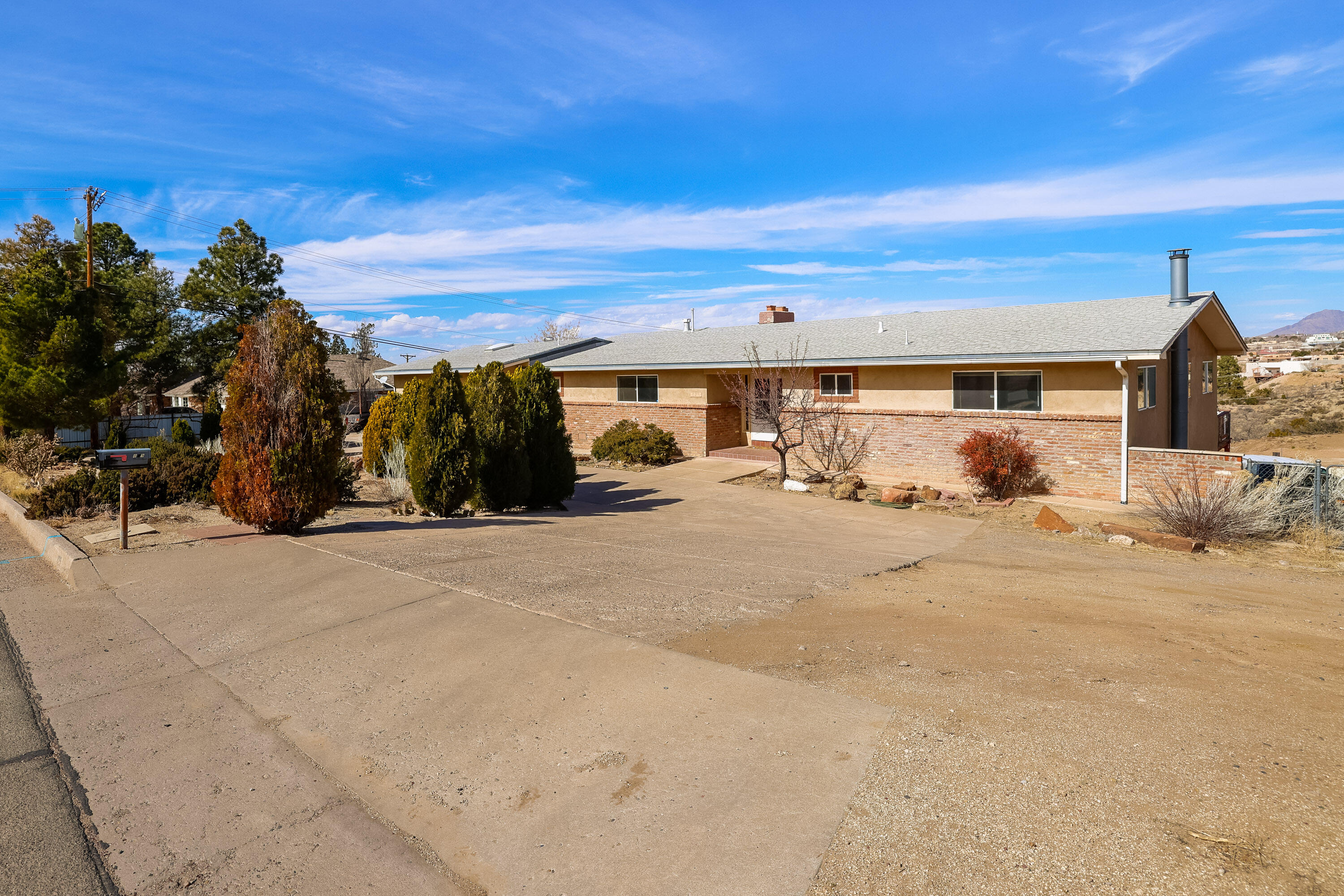 Open House: Saturday, 02/22/25 (11:30 am-1:30pm). Stunning City and Mountain views.  Beautiful ranch-style  6 Bedroom, 4 bath home in Four Hills with nice floorplan perfect for entertaining or multi-gen living. Enjoy the outdoors with mature fruit and nut trees. Backyard access.