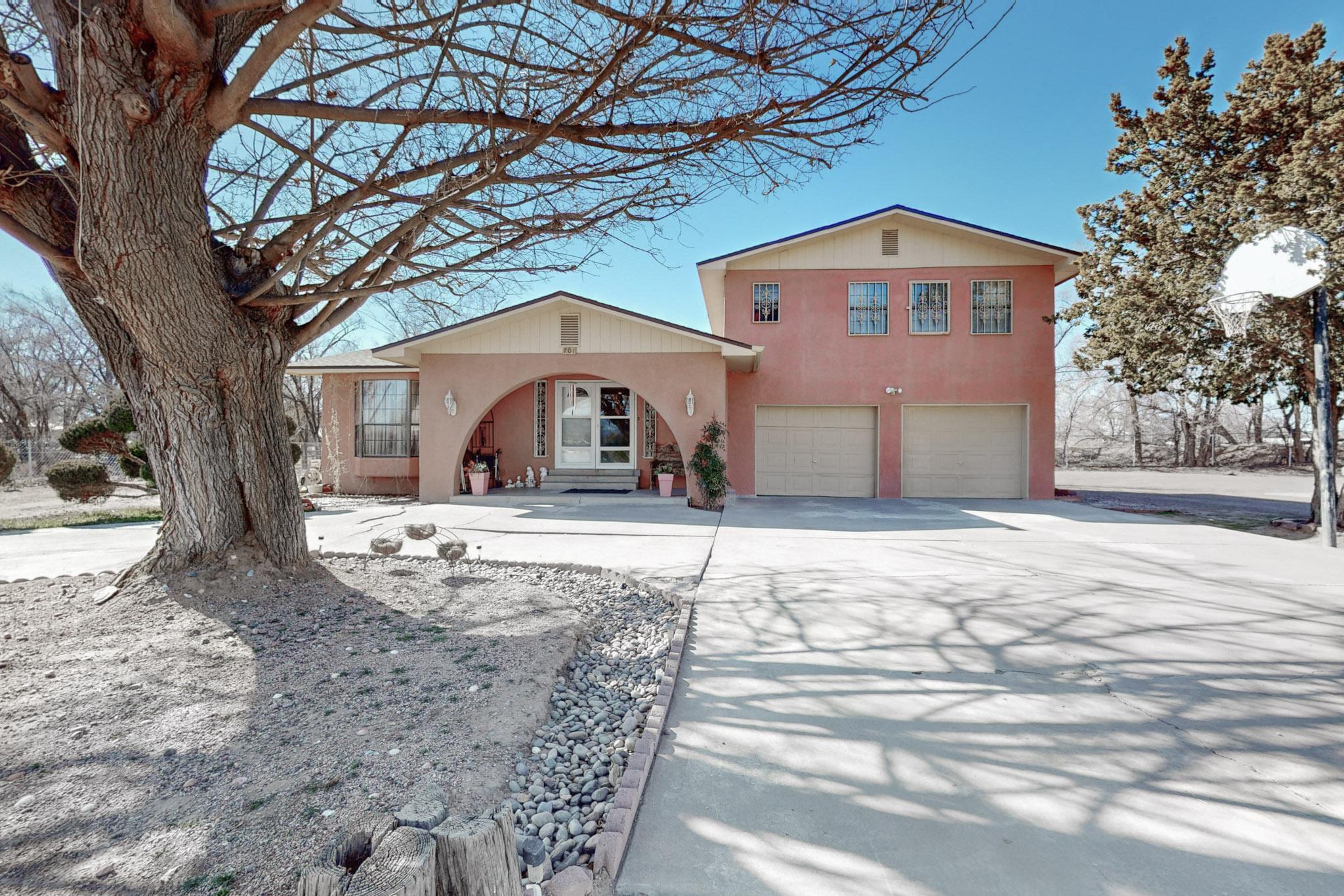 This property offers a unique opportunity with both residential and commercial potential! Located in Bosque Farms, it features a charming three-bedroom home with a four-car garage, plus a versatile casita currently used as a recreation room perfect for entertaining or guest accommodations.The property sits on a spacious 1-acre lot, while the adjacent 0.5-acre lot includes a warehouse with a large office space, a barn with four horse stalls, and a functioning well for additional water access. The master bedroom features an attached office space, adding to the home's functionality.With irrigation wells, ample space for horses, and the flexibility to run a business, this property is ideal for those seeking a blend of comfort and opportunity.