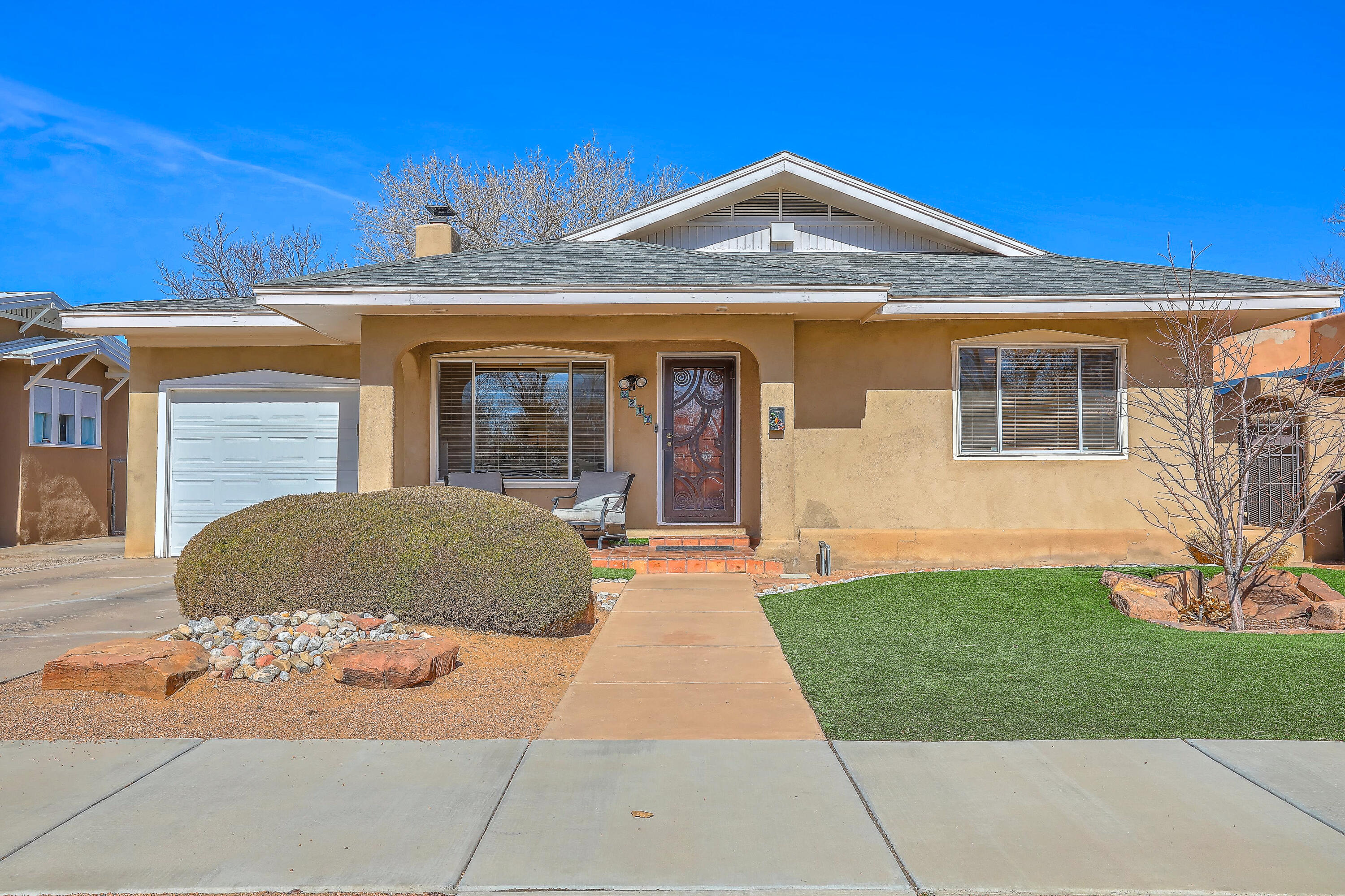 A unique opportunity to own your dream home across from the Albuquerque Country Club golf course.  Come check out these incredible  features; 2418 sq. ft, 3 large bedrooms, 3 baths, back bedroom has its own bathroom and attached living room, perfect for a private guest suite or multigenerational living!  In-laws? Teens? Home office?  The possibilities are endless!  Primary suite has an amazing spa-like bathroom, large soaking tub and gorgeous wood custom closet.  Step outside onto a private, beautiful deck, large shade tree, extra large hypoallergenic turf area  and concrete for your own 1/2 basketball court, tiled corner for a large trampoline.  All this space with low maintenance! Natural wood, saltillo and travertine floors, epoxy finished garage.  Refrigerated air.   The list goes on.