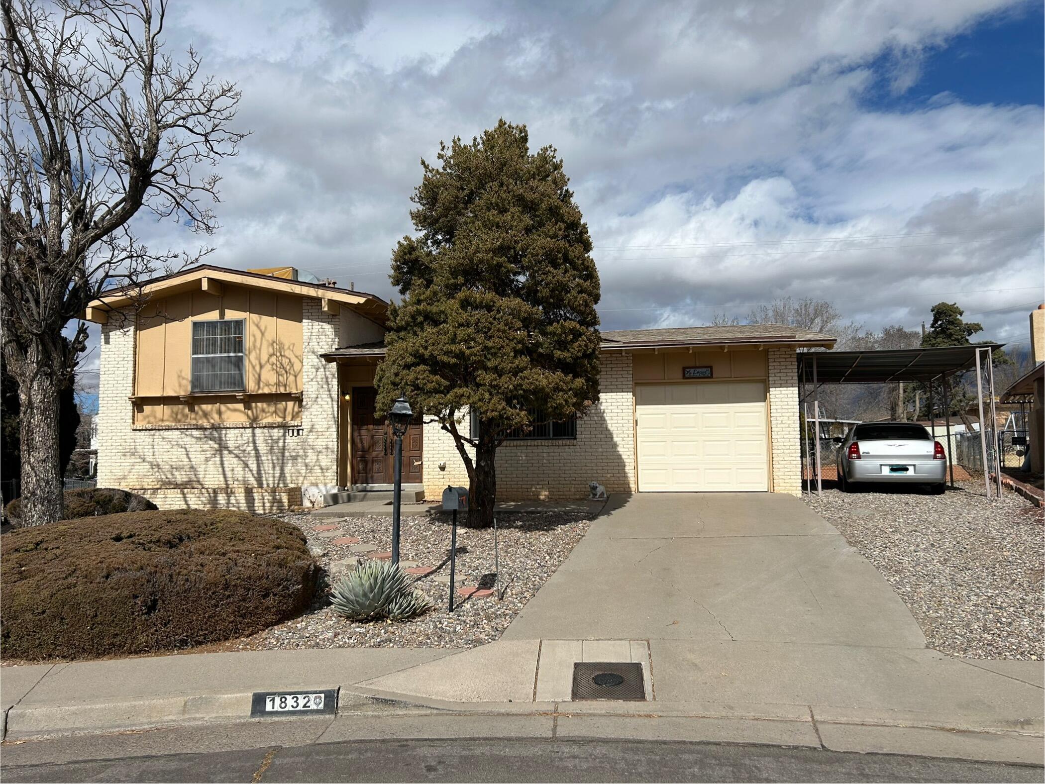 This NE Height's Beauty will take your heart away with it's charm & well cared features. This well thought out designed split level home offers 2 nicely separated living area's. The front living area, which seems more formal, is on the main floor & offers vaulted ceilings. The down stairs living area offers that more cozy feel especially when it offers this nice brink front gas log fireplace and awesome paneling. In this cute eat in kitchen with vaulted ceilings has some must appreciate features like it appliances, well cared for cabinets, counter tops and the brick tile. So great to see such care. The whole house is clean. Large landscaped backyard offers a path for exercising. 1 car garage with opener plus carport off the garage helps with parking in this wonderfully placed cul-de-sac.