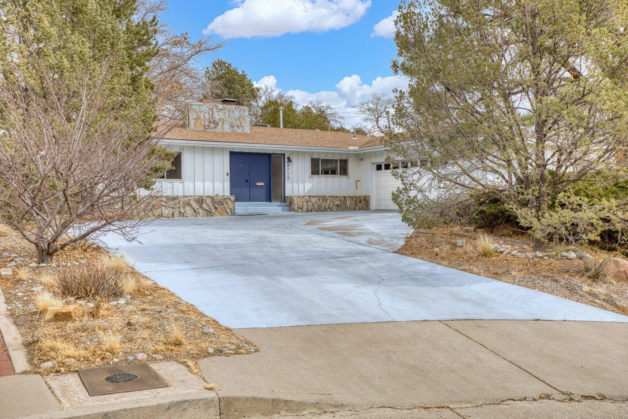 Owner-transformed home with high-quality upgrades. This renovated mid-century modern home in the Altura Park neighborhood features 3 bedrooms plus a flexible 4th bedroom option. Every detail has been updated, including a new HVAC system, fully replaced electrical and plumbing, and sleek, water-resistant LVP flooring. Luxurious bathrooms boast double vanities, gold finishes, and the primary has a Toto bidet. A finished garage, designer lighting, and a stylish office (flex space) with a new glass slider make this home truly move-in ready. Plus, the park is just a 10-minute stroll away!Enjoy easy access to I-40, UNM, Nob Hill, Uptown, and Whole Foods.