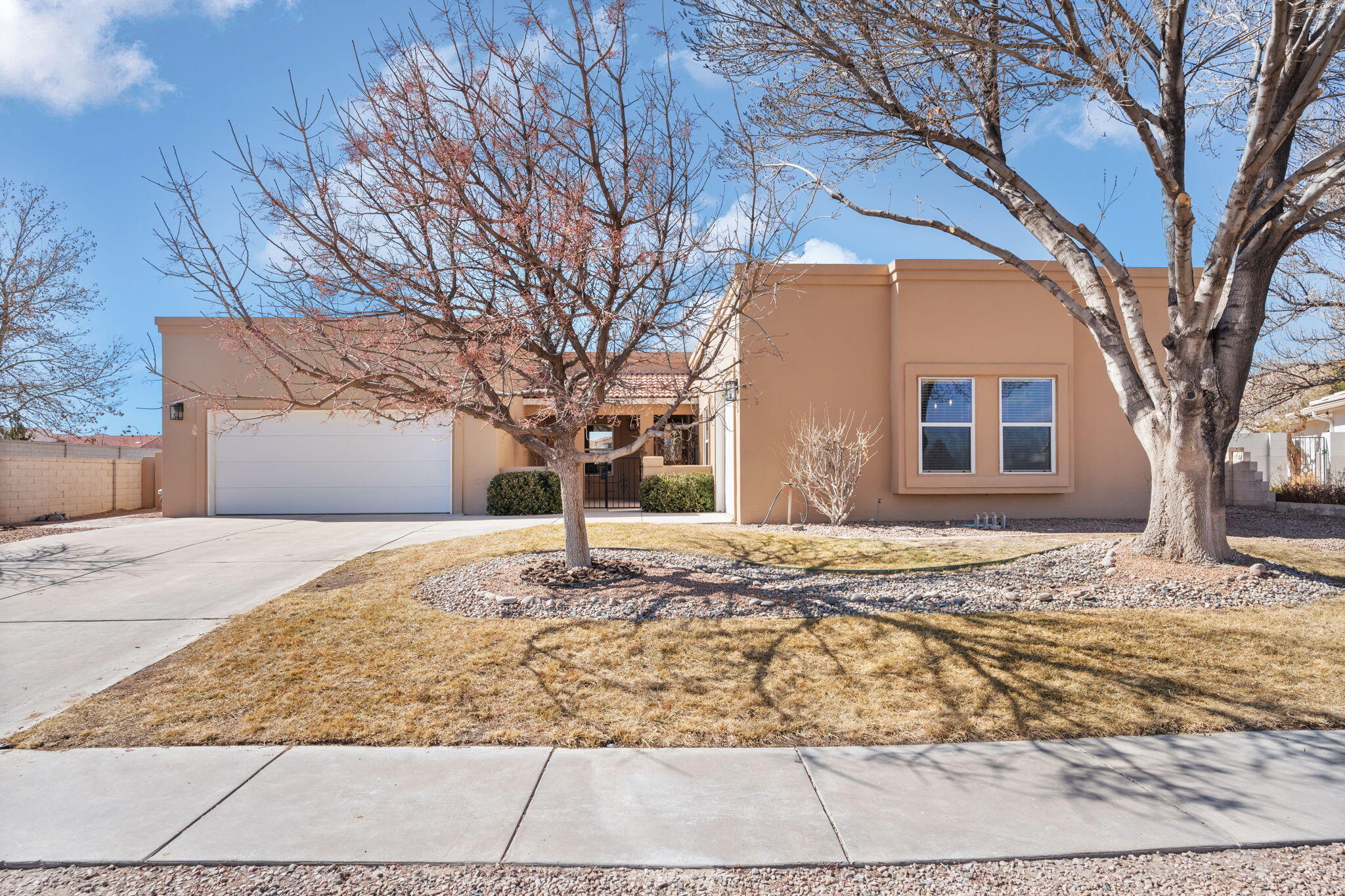 This beautifully updated 4-bedroom home offers comfort, style, and privacy.  Fresh updates include a newly remodeled primary bathroom, new kitchen countertops, fresh paint, new carpet, and modern light fixtures.  The bright, open floor plan is perfect for entertaining, while the large covered back patio provides a relaxing retreat with no backyard neighbors--just peaceful open space.  The third-car garage features its own half bathroom, offering extra convenience and flexibility.  With modern upgrades and a prime location, this home is truly a must-see!