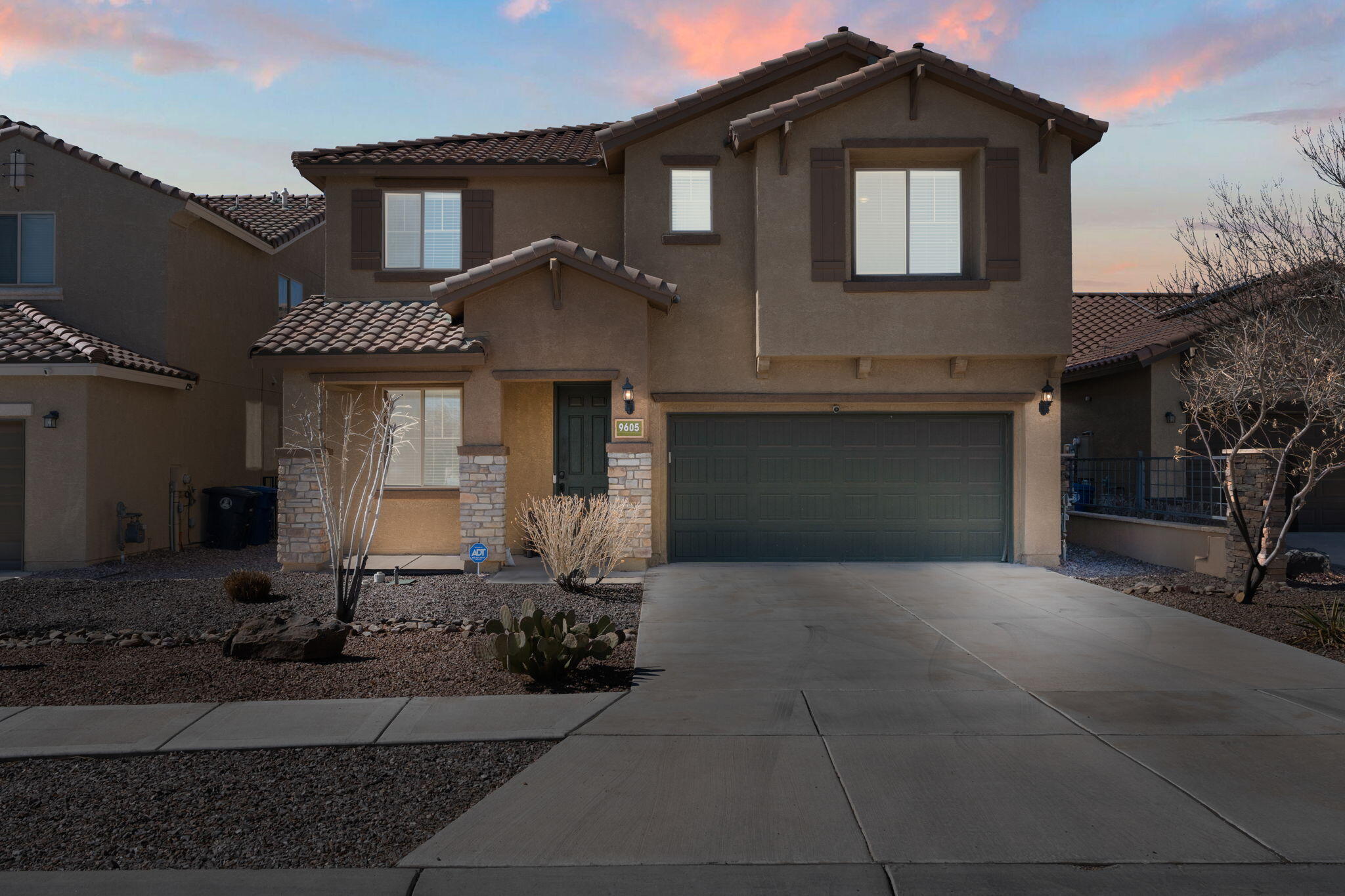 Live in luxury in one of The Boulders' finest  5-bedroom homes! A stunning stone facade and full landscaping welcome you inside. The open-concept design impresses, starting with a front office and a chef's kitchen featuring granite counters, stainless appliances, a walk-in pantry, and an oversized island with bar seating. Upgraded tile flooring ties the living areas together beautifully. The spacious first-floor primary suite offers a spa-like bath and walk-in closet. Upstairs, enjoy a second living area, a second owner's suite with a private bath, three more large bedrooms, a full bath, and a laundry room. The Boulders is one of Albuquerque's most desirable communities, with PDN, retail shops,  parks, and trails just minutes away! Schedule your private showing today!