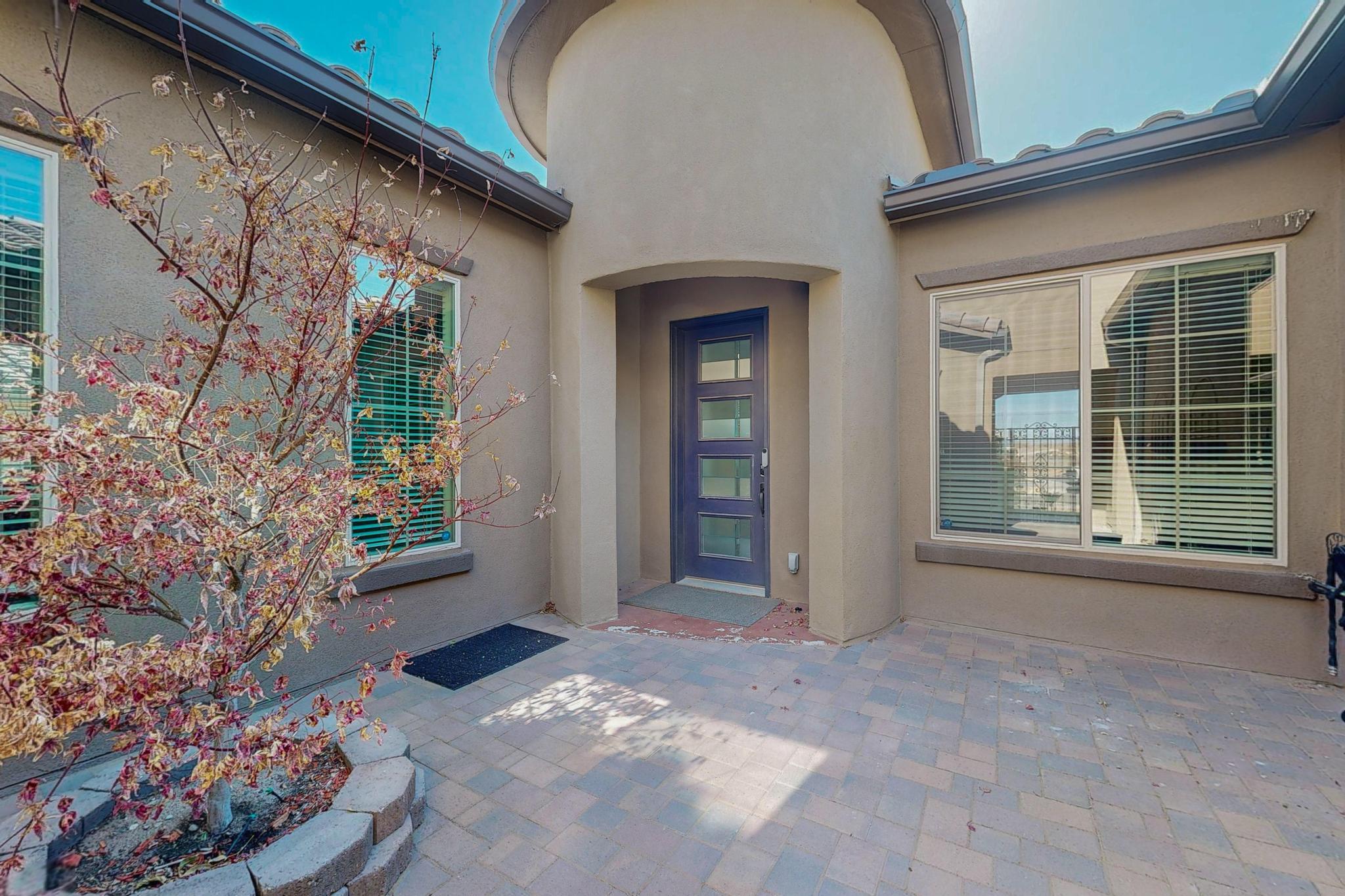 This stunning home is filled with upgrades and modern touches! Enter through the courtyard into the elegant tundra foyer with vaulted ceilings and barreled hallways, creating a bright, open feel. The gourmet kitchen features an oversized quartz island, pull-out cabinetry, Whirlpool appliances, a 5-burner gas stove, double oven, and a spacious walk-in pantry. Plank tile flooring runs throughout most of the home, with plush carpet in the bedrooms. The primary suite offers a luxurious retreat with an upgraded California Closet. The private, fully landscaped backyard showcases breathtaking mountain views. This well-maintained home also includes a separate living space or in-law suite. Don't miss out on this exceptional home, schedule a showing today!