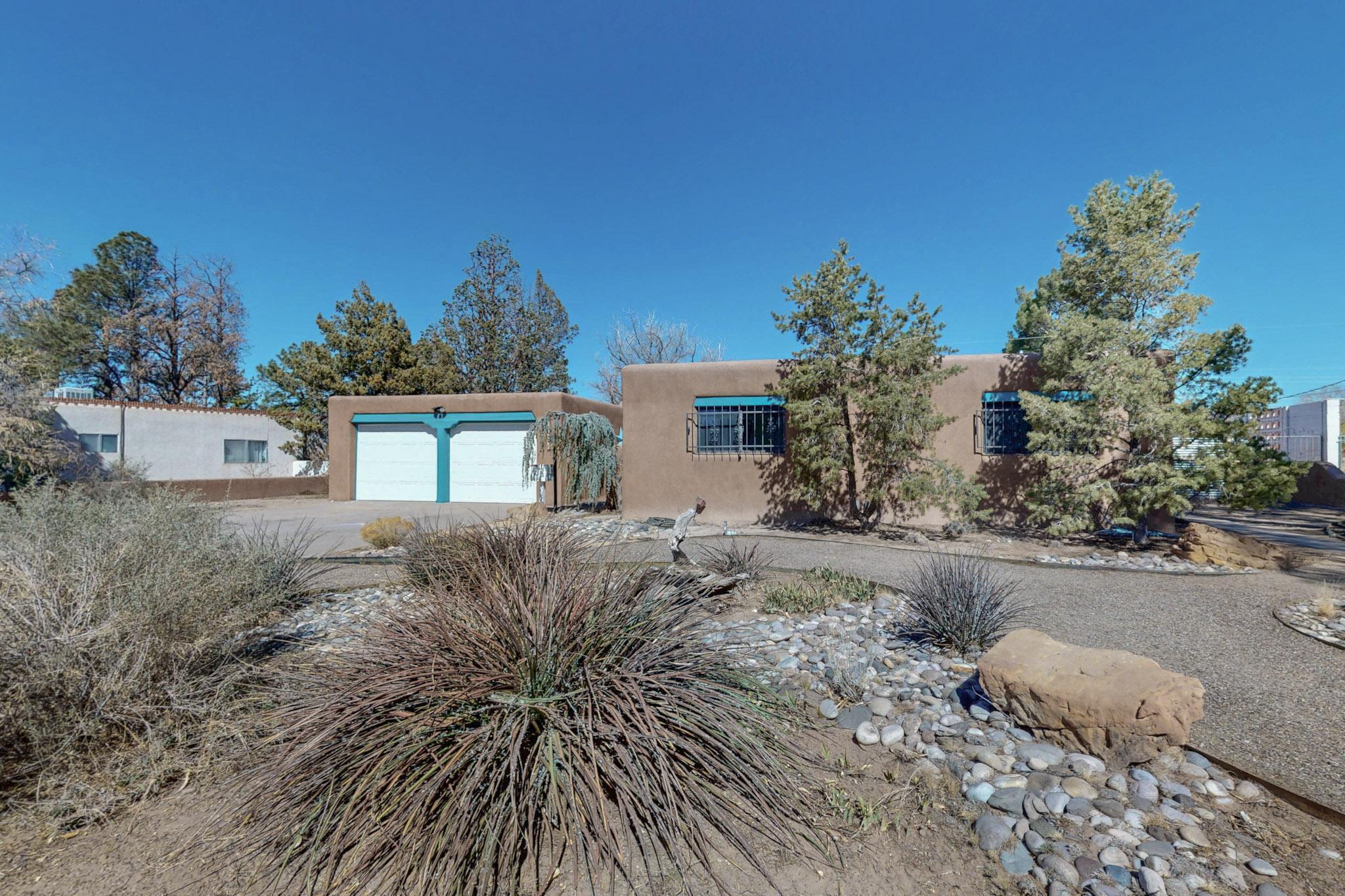 Big family? Love to entertain? Welcome to your new home, close to Sandia Labs and KAFB. This true adobe home boasts too many improvements to list, ensuring a comfortable and stylish living experience. With two fireplaces, including one with a wood-burning insert, you'll stay cozy all year round. The five nice-sized bedrooms and office/library provide plenty of space for you and your loved ones. The oversized recreation room with a built-in charcoal grill is perfect for entertaining guests. Dining for 40 can be easily accommodated or use it as a game room with multiple table games (pool, air hockey, or foosball) as possibilities.
