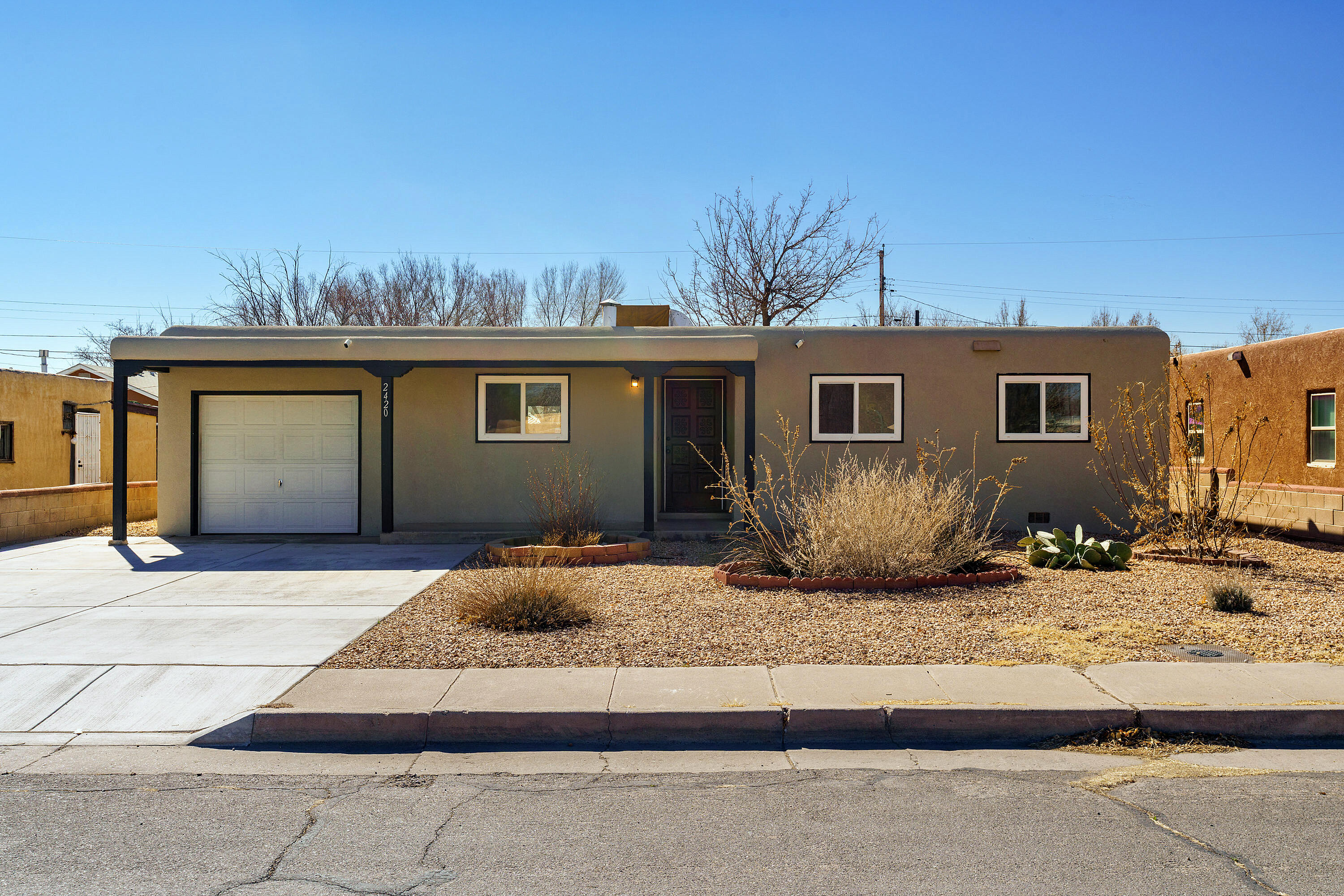 Charming, updated home on Iris Rd, near Matthew & Rio Grande! This single-story gem features an open-concept living, dining & kitchen area, virtually staged to inspire layout ideas. Both baths are tastefully updated, with the primary suite boasting its own full bath. Comfort year-round with 4 mini splits--yes, one per bedroom! Thoughtful upgrades include newer windows, updated electric panel & stucco. The backyard awaits your dream outdoor retreat. Just 5 mins to La Montanita Co-op & Subway and 20 mins to Crossbow Coffee & The Range Cafe. Enjoy easy access to Rio Grande walking and biking trails! Schedule your showing today!