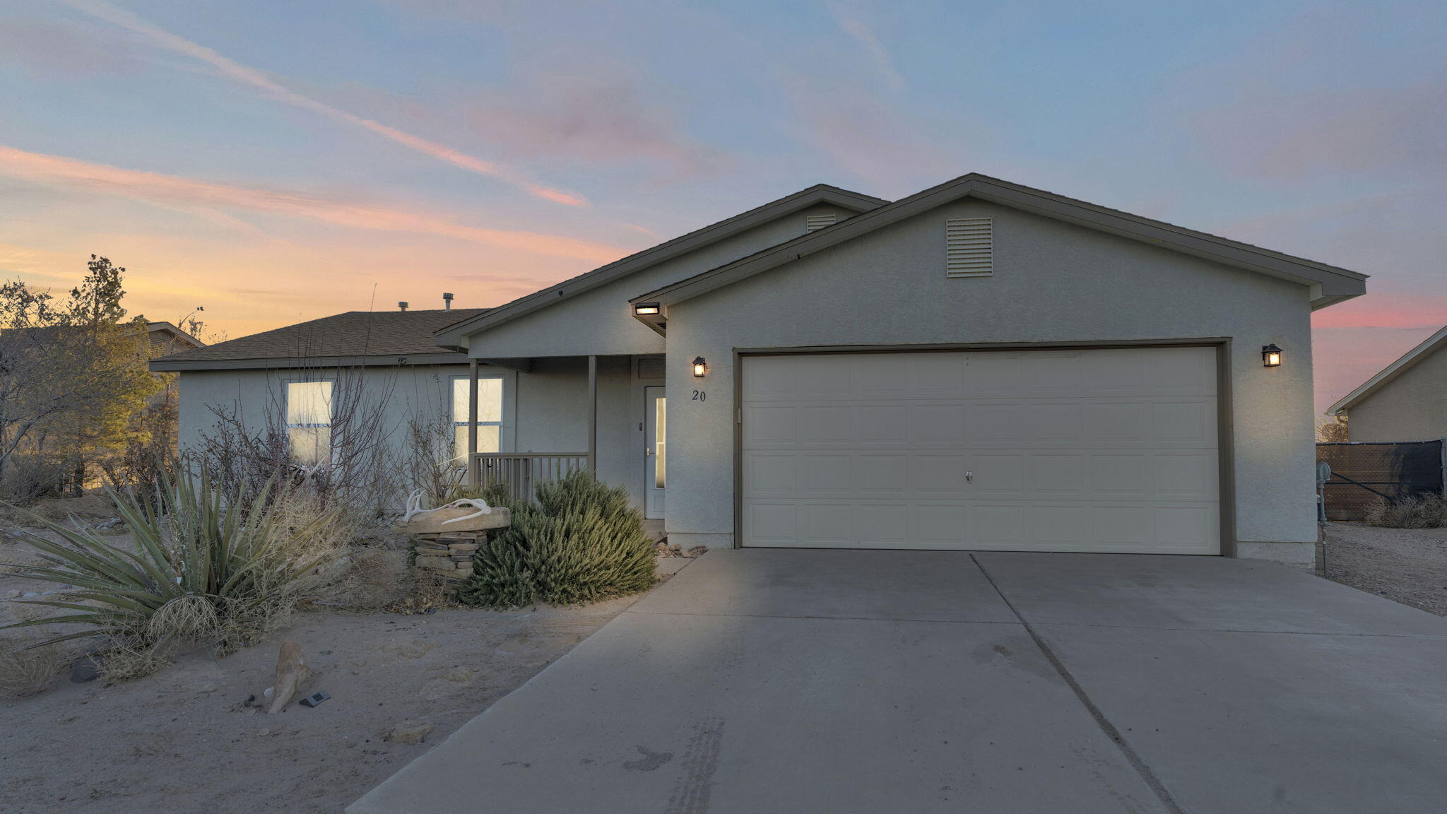 Welcome to your dream home! This beautiful 1,550 sq. ft. residence features three bedrooms and two bathrooms, set on a gorgeous half-acre lot with spectacular views of the Sandia Mountains. The open floor plan is flooded with natural light, complemented by fresh paint, newer tile flooring in the main areas, and cozy carpeted bedrooms. The kitchen is equipped with stainless steel appliances, elegant butcher block countertops, and a charming breakfast nook. Retreat to the spacious primary bedroom, which includes double sinks, a large closet, and a roomy shower. An expansive enclosed sunroom offers additional space for entertaining. The fenced backyard is perfect for outdoor living, complete with a shed and access for larger vehicles like an RV or boat. Don't miss this wonderful opportunity!