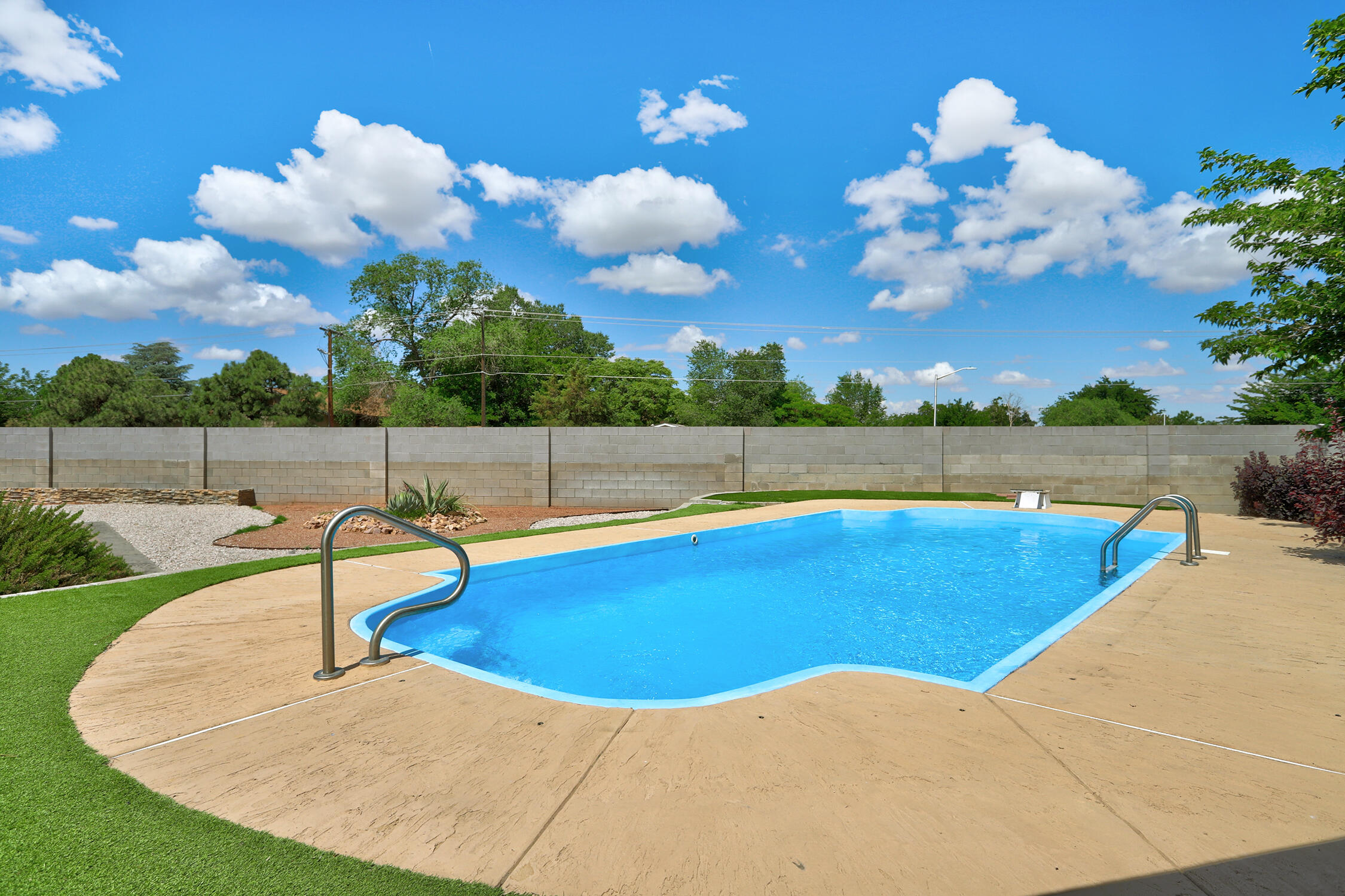 Welcome to your dream retreat in the Del Norte Neighborhood! This charming 4-bedroom, 2-bath home boasts a private heated pool, perfect for those hot summer days. Dive into the 11-foot deep, 28-foot long oasis or relax in the beautifully landscaped backyard, complete with a newly elevated wall for added privacy. Enjoy sunsets from the comfort of your outdoor living space and take in the breathtaking mountain views from your primary bedroom balcony. The backyard also features a built-in propane grill as well as a build in charcoal grill and the inviting Evo 2 dancing fire firepit, creating the ideal atmosphere for entertaining guests or unwinding after a long day. Discover the perfect blend of relaxation and entertainment in this inviting residence.