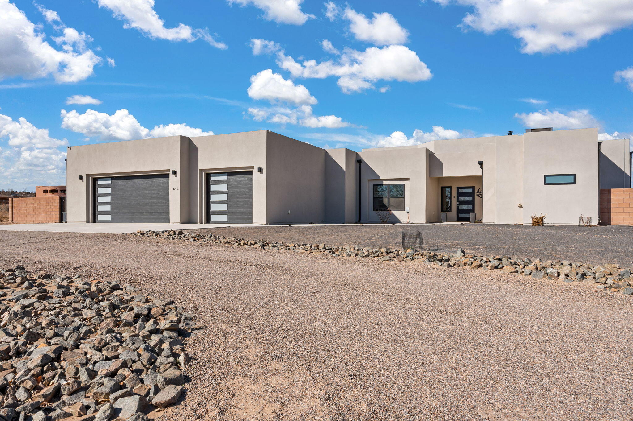 Don't miss this great opportunity! Stunning custom home on 1 acre, built in 2022. This home features 4 bedrooms plus a bonus office (possible 5th bedroom), 3.5 baths, and an oversized 6-car garage. Enjoy an inground pool with jacuzzi, solar panel system, and RV access. The backyard is designed for entertainment with a basketball court, kids playground, putting green, fenced garden, and a huge dog run. Inside, the open floor plan offers a chef's kitchen, and spacious living area. The high-end finishes, soaring ceilings, and abundant natural light create a welcoming and modern atmosphere. The oversized garage provides ample storage or workshop potential for car enthusiasts. Conveniently located near retail, restaurants, and major amenities, this home offers both luxury and practicality.