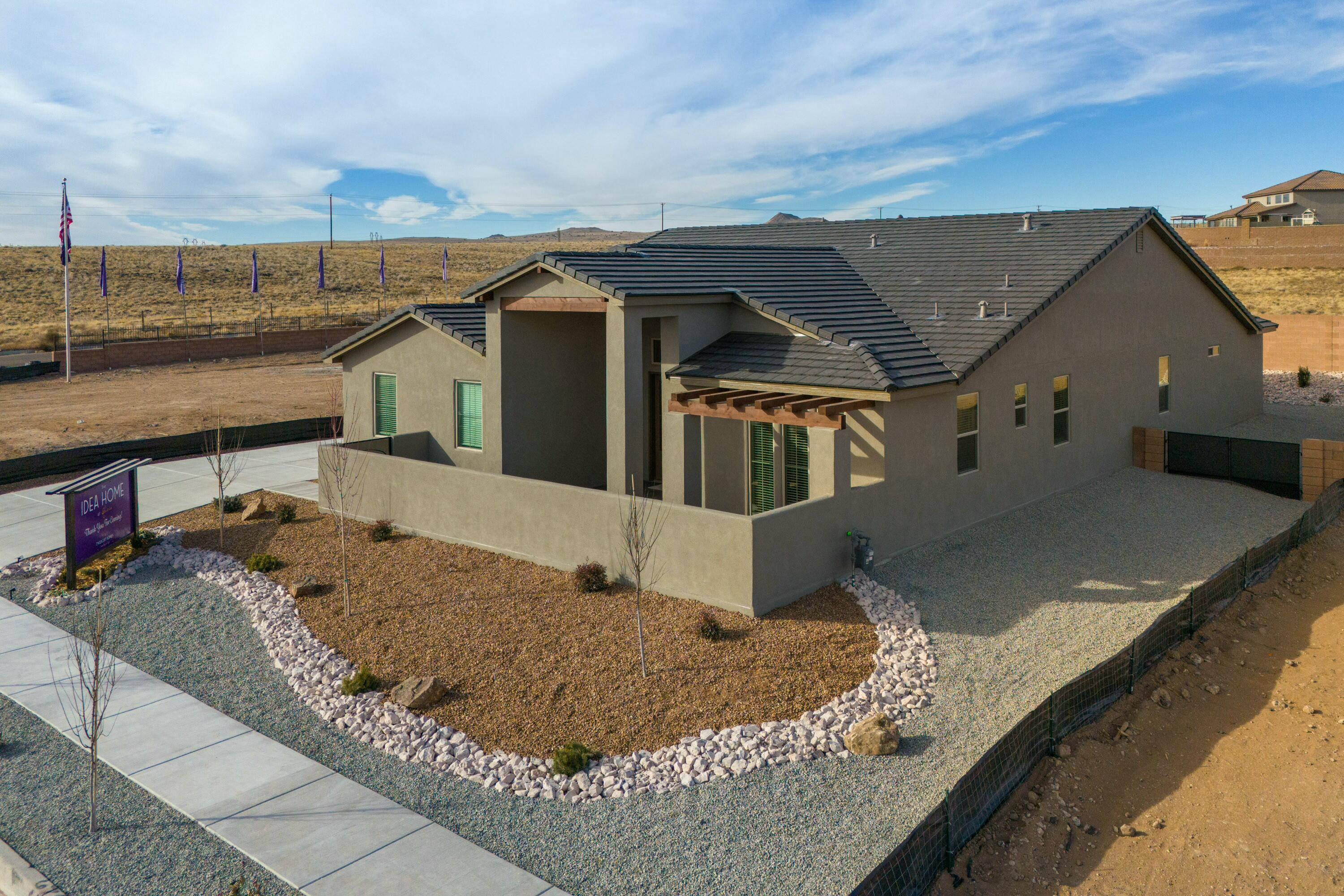 Come view this beautifully appointed home in the new community of Quivira featuring view lots and a serene setting. Situated on a 1/4 lot with a 3-car garage you will love the large front porch that ushers you into the large, private foyer with 14' ceilings. Wood beam ceiling accents and a double sided fireplace separating the living and dining rooms for a cozy but elegant look. Large butler's pantry tucked behind the kitchen is perfect for staging dinner parties and offers massive storage with a prep counter for your coffee machine. Tons of storage in the kitchen. 2 owner suites. Each w/walk in closets and dual vanities. Owner baths feature tubs and walk in showers which incl rain head and wall shower mounted head. 9 x 36' covered back patio. Much more to see and love. Very ltd # lots.