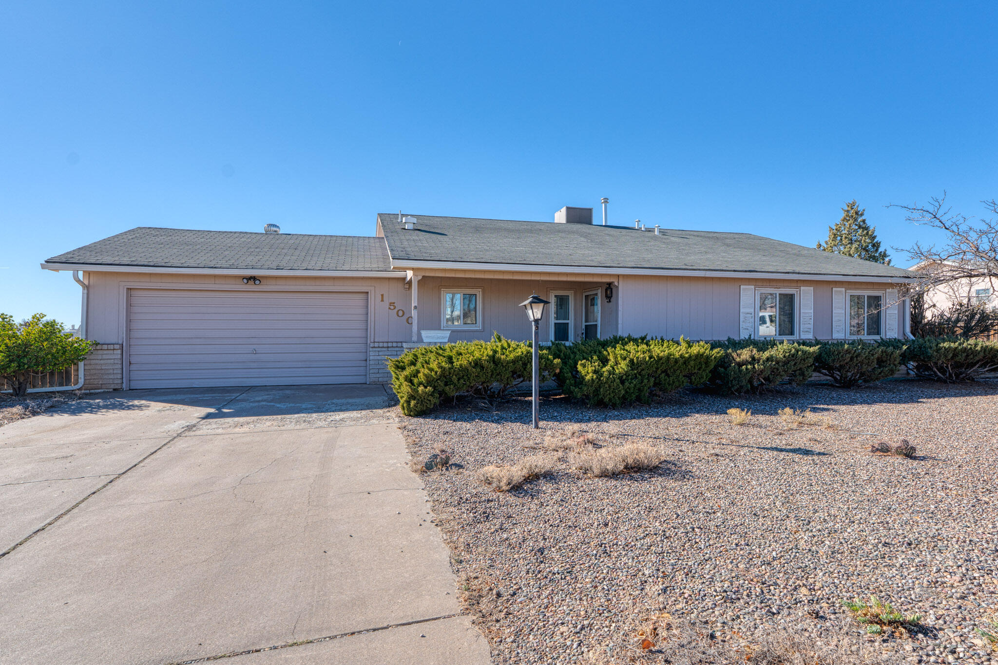 LISTING UPDATED WITH A NEW ROOF. Welcome to this classic Rio Rancho home, complete with Sandia Mountain views. A NEW ROOF scheduled to be put on by the end of March. Seller will pay for a NEW SEPTIC system. It also has newer windows, water heater, furnace and evaporative cooler. There is a  professionally installed Sandia Sunroom to enjoy the mountain views in comfort. Split bedroom design has a large primary bedroom, plus 3 other bedrooms, and 2 full bathrooms. Large .51 acre lot. The washer and dryer stays in a separate laundry room. The home also has a wood burning fireplace, 2 car garage and storage or work shop space in the garage.
