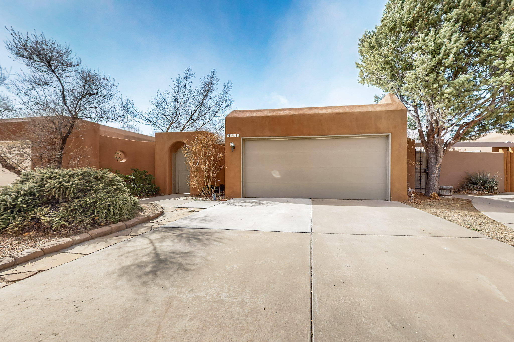 This beautifully maintained 2-bedroom, 1 full bath, and 1 three-quarter bath luxury patio home in the desirable Thomas Village neighborhood features an open floorplan with updates, upgrades, and improvements throughout. Enjoy entertaining in the quaint courtyard or dining al fresco. This sought-after Leslie-built patio home boasts Southwestern charm in a close-knit community. The dramatic interior showcases raised beam ceilings, a wall of windows, and a corner fireplace. The primary suite includes a luxury bath, dressing area, and backyard access. The courtyard entry, patio, and gardens back onto a lateral ditch. Conveniently located within walking distance to the river and nature center, and close to the freeway, shopping, and downtown. Includes a 2-car garage.