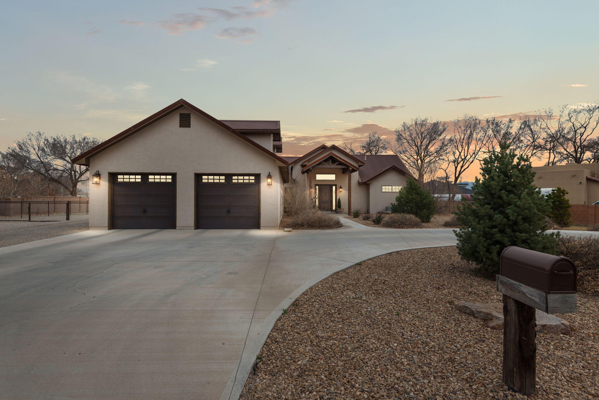 This stunning 2019 custom home in Bosque Farms is set on a beautiful landscaped, fenced .75-acre lot with irrigation. The open floorplan boasts cathedral ceilings, wood beams, and tongue & groove accents, blending rustic charm with elegance. The chef's kitchen features granite countertops, ample cabinetry, a stylish wood-top island with bar seating, and a pantry. With upgraded lighting, ceiling fans, recessed lighting, refrigerated air, office space, and a dedicated laundry room, every detail is designed for luxury and comfort. The oversized 2-car garage, 50x14 RV parking, and a 50x30 shop make this home a dream for hobbyists and project lovers. Outside, a covered patio, vast yard, and easy backyard access offer endless possibilities for outdoor living. Don't wait & schedule today!