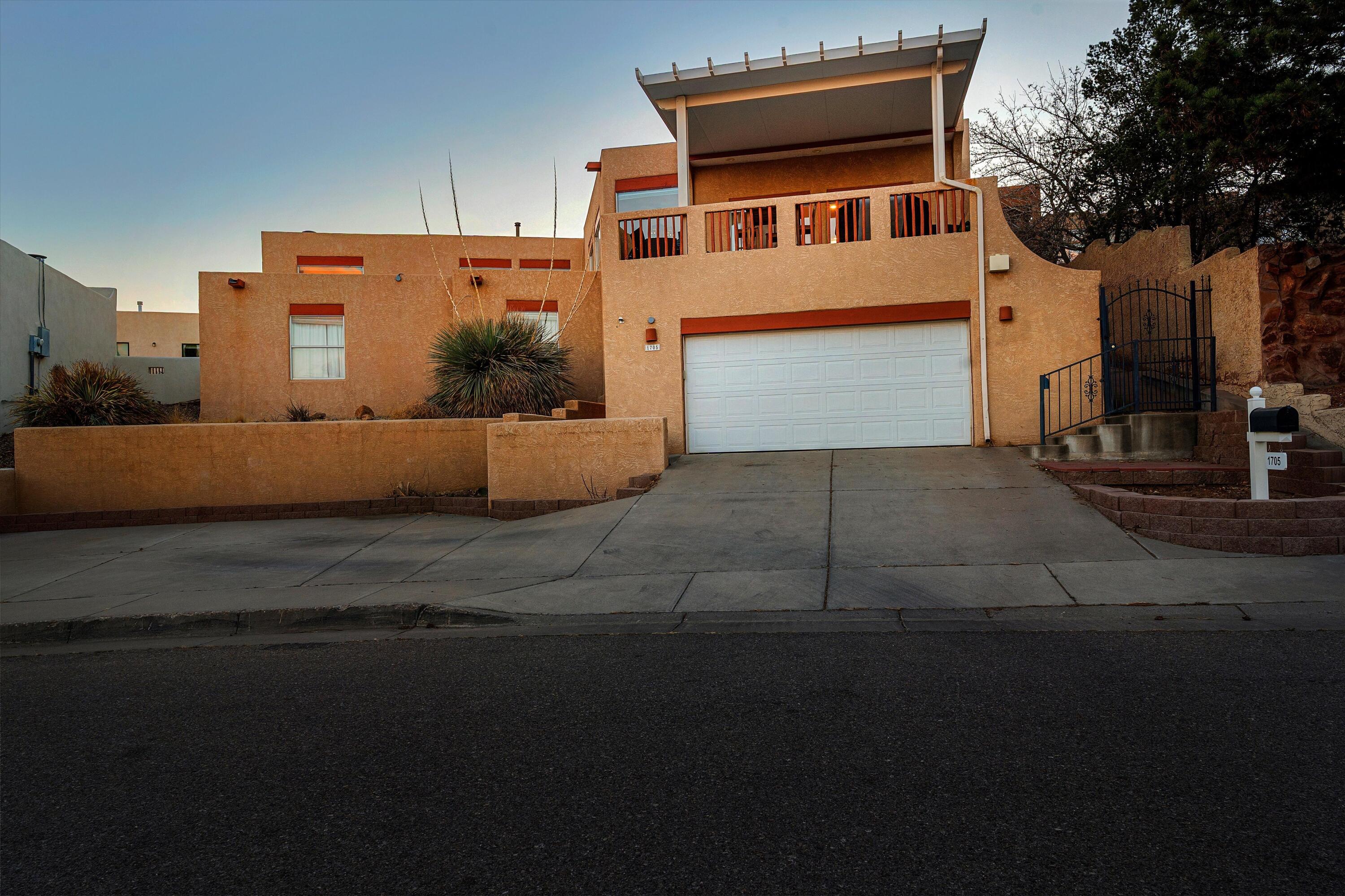 Stunning Bosque Views! Nestled in a neighborhood rich with Southwestern charm, this 4-bedroom & 3-bath home is a true gem. Step inside to find a warm and inviting living space featuring a cozy fireplace, beautiful laminate and tile flooring, and hand-carved ceiling beams that extend into the open-concept living area. The kitchen seamlessly flows into the dining and living spaces, while a wall of windows and elegant French doors flood the home with natural light and frame breathtaking views of the Bosque. A versatile downstairs bedroom or office adds convenience, and a striking circular staircase makes a grand impression at the entryway. Just minutes from downtown and shopping, this home offers both beauty and convenience. Don't miss this incredible opportunity--schedule your showing now!