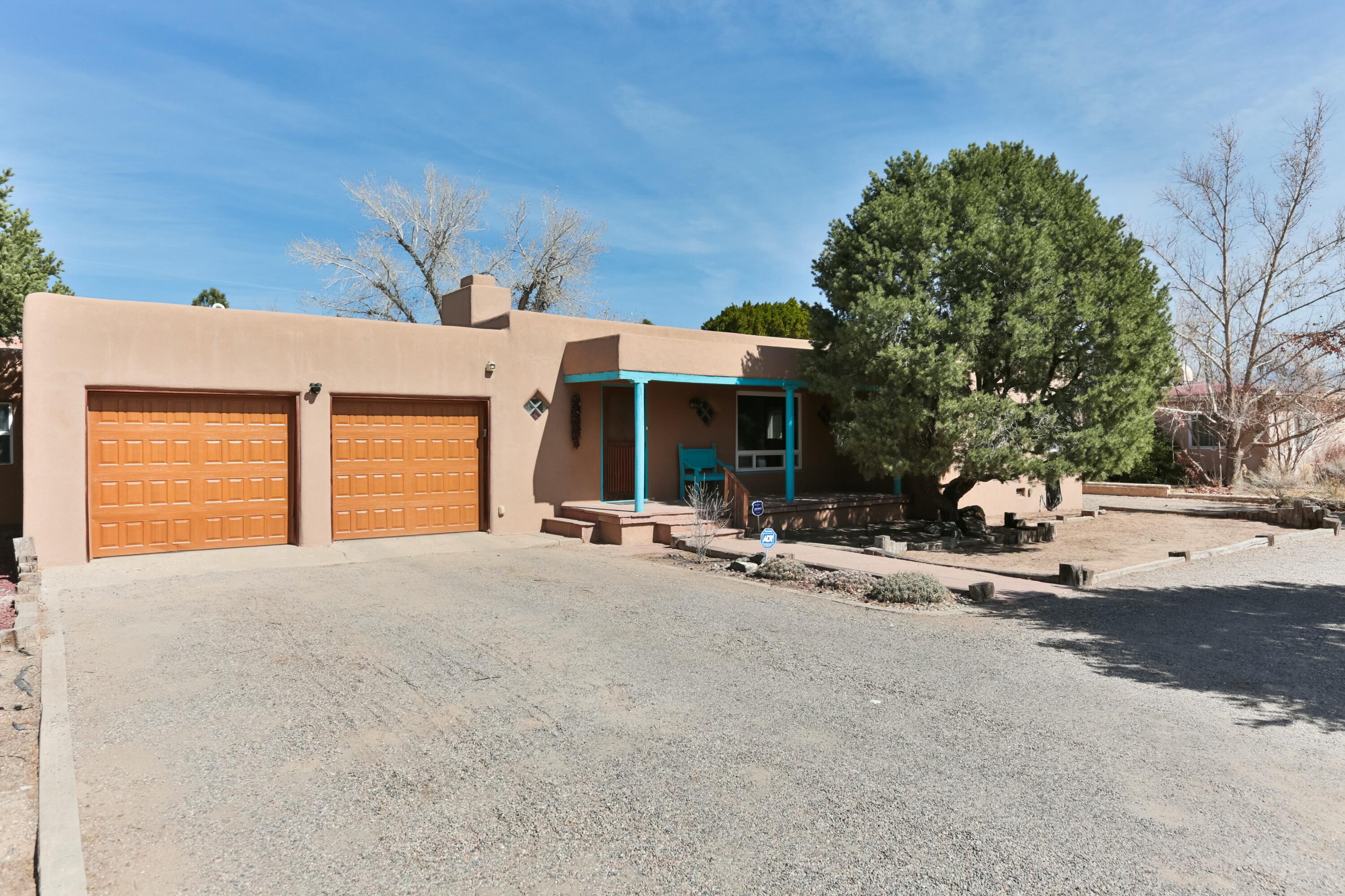 Welcome to 627 Fairway Road NW, a lovingly maintained property in the coveted North Valley of Albuquerque, this is a property you don't want to miss. This 4-bedroom, 3-bathroom property checks all of the boxes, featuring an expansive layout that offers flexibility and options for its next owner. The main house, which boasts 3 bedrooms and 2 bathrooms, is designed with both functionality and charm in mind. Built-in bookcases and bancos add a touch of warmth, while hardwood floors (some currently covered by carpet), create a timeless appeal. The spacious and airy living and dining rooms along with the open kitchen are the heart of the main house, where there is plenty of room for relaxation or entertaining.