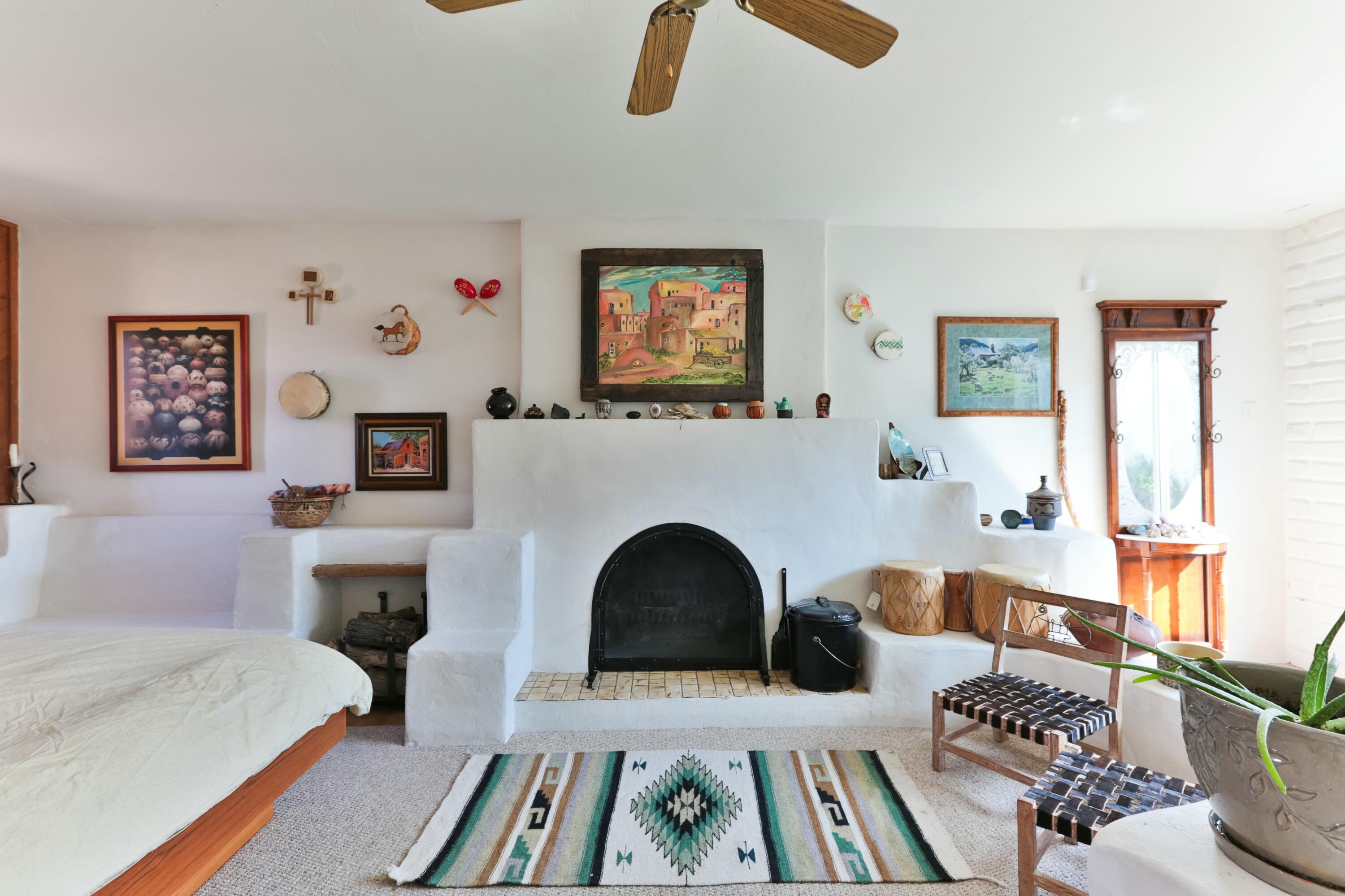 Welcome to 627 Fairway Road NW, a lovingly maintained property in the coveted North Valley of Albuquerque, this is a property you don't want to miss. This 4-bedroom, 3-bathroom property checks all of the boxes, featuring an expansive layout that offers flexibility and options for its next owner. The main house, which boasts 3 bedrooms and 2 bathrooms, is designed with both functionality and charm in mind. Built-in bookcases and bancos add a touch of warmth, while hardwood floors (some currently covered by carpet), create a timeless appeal. The spacious and airy living and dining rooms along with the open kitchen are the heart of the main house, where there is plenty of room for relaxation or entertaining.