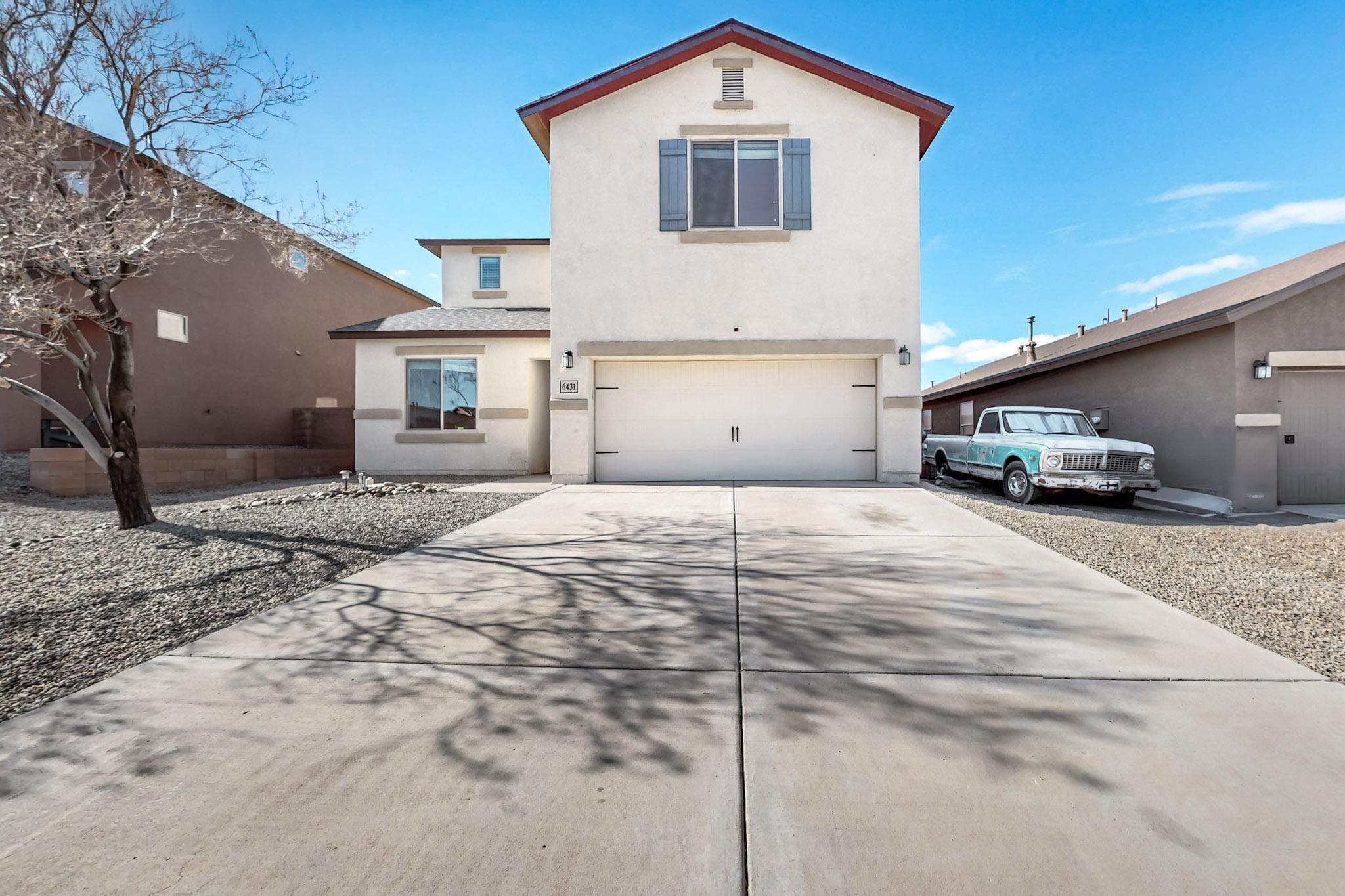 Discover contemporary comfort in this beautifully appointed Rio Rancho home featuring five bedrooms and two and a half bathrooms. The thoughtfully designed open floor plan showcases a convenient downstairs primary bedroom with an ensuite bathroom, complete with double sinks and a generous walk-in closet. The kitchen delights with stainless steel appliances and ample space for culinary adventures. Fresh updates include new carpet and laminate flooring throughout. A versatile loft area adds flexible living space, while the clean-slate backyard awaits your personal touch. This bright and airy home offers the perfect blend of modern living and family functionality. Your dream home awaits!