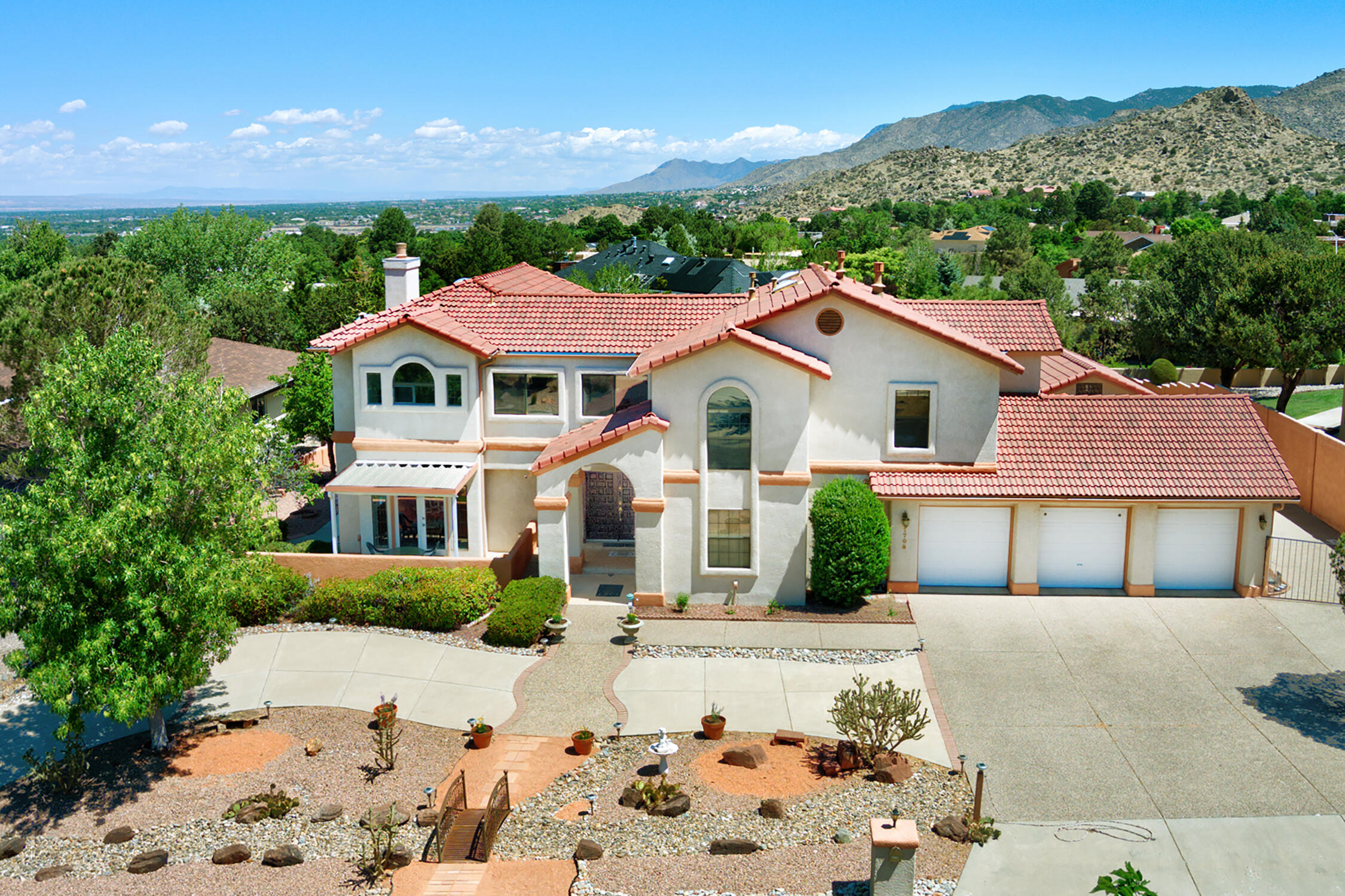 Eric Spurlock an award-winning architect  designed this DREAM, 3 car garage, 5-bedroom HOME has everything & Outstanding Expansive VIEWS!  Plus, it has a 1200+ sq ft Workshop, possible of a Casita, Gym with a Spa, Studio, what are your needs? - plus in this area it has a dark room, shower and sink. A double door to a light filled foyer leads to a spacious Living - Dining area. Then to a second living area with a fireplace and opening to a sunroom. Then to the Bright Cook's kitchen with lots of space, SS appliance, breaskfast nook+doors to covered patio. One bedroom on  main level, 3/4 bath & laundry room. Upstairs you have a king-size Primary Suite w VIEW balcony, walk-in closet & Spa bath.  3 more bedrooms & a large full bath. Private backyard with patios is a must see! + SO MUCH MORE