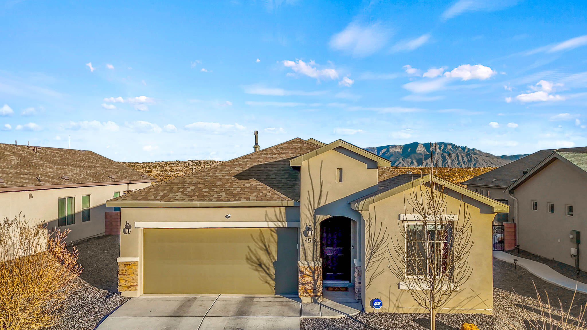 This Hakes Brothers home offers 4 bedrooms, 2 bathrooms, and upgraded wood look tile flooring throughout. Enjoy the spacious feel of high ceilings and tall doors. The kitchen features granite countertops, a stylish backsplash, elegant light fixtures and a gas cooktop. Stay comfortable year-round with refrigerated air.The primary bathroom includes a luxurious rain shower for a spa-like experience. The xeriscaped yard ensures low maintenance, while breathtaking Sandia Mountain views provide a stunning backdrop. No need to wait for new construction, this well maintained home is move-in ready.