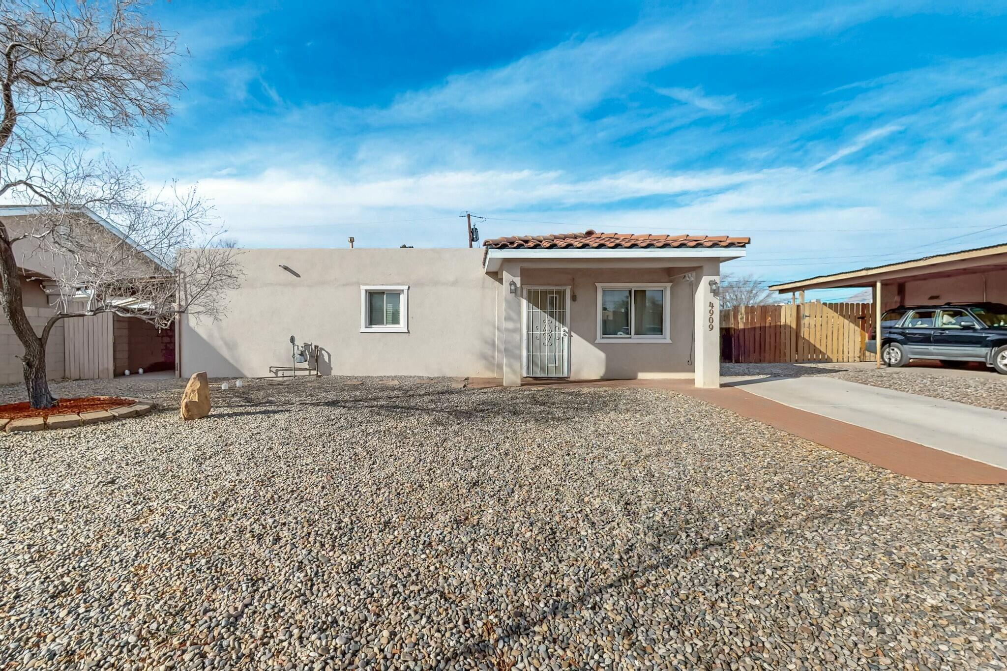 Multi Generational Living or Income Producing! Main has 1 large primary suite with clerestory walk in closet and ensuite bath and its own tankless water heater. Living room, grand dining room and remodeled kitchen. High end appliances. The second space INLAW SUITE/CASITA has 1 and 1/2 bath two ample bedrooms/office/living. PLUS its own space that is set up as a kitchen. Both spaces have access to the detached laundry. The home includes a new roof end of 2022 and refrigerated air 2021. Updated electrical and water heater. Near Vilella Park, shopping and entertainment. This one-story home has no steps, oversized doorways, and no carpet, with a serene, organic color scheme. Such a great versatile use of space.
