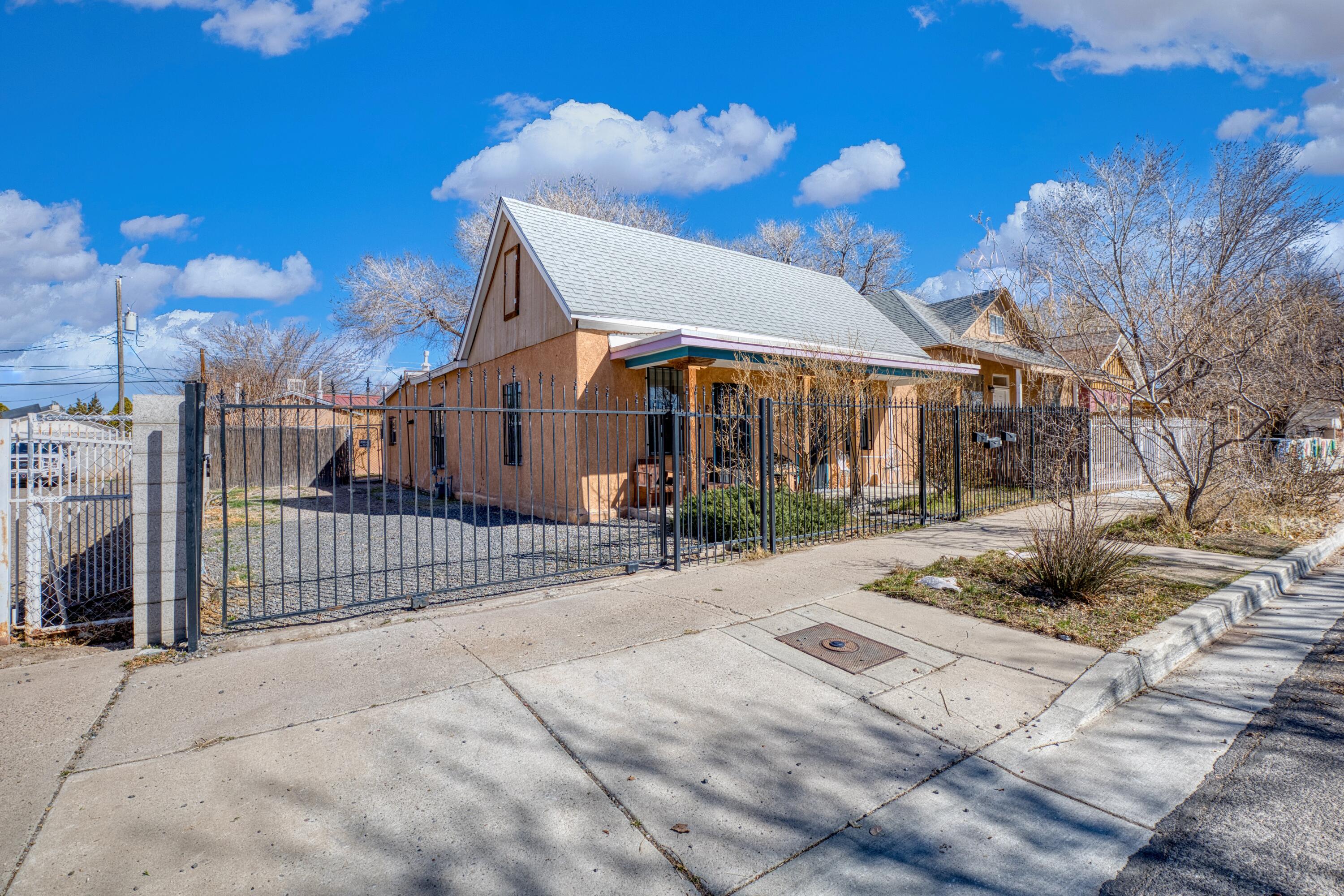 Prime investment opportunity in the heart of downtown Albuquerque! This charming triplex boasts three fully furnished 1-bed, 1-bath units with eat-in kitchens, consistently operating at 90% occupancy on Airbnb. Previously a go-to rental for traveling nurses on 3-9 month stays. Conveniently located near hospitals, dining, and entertainment, it's a must see!