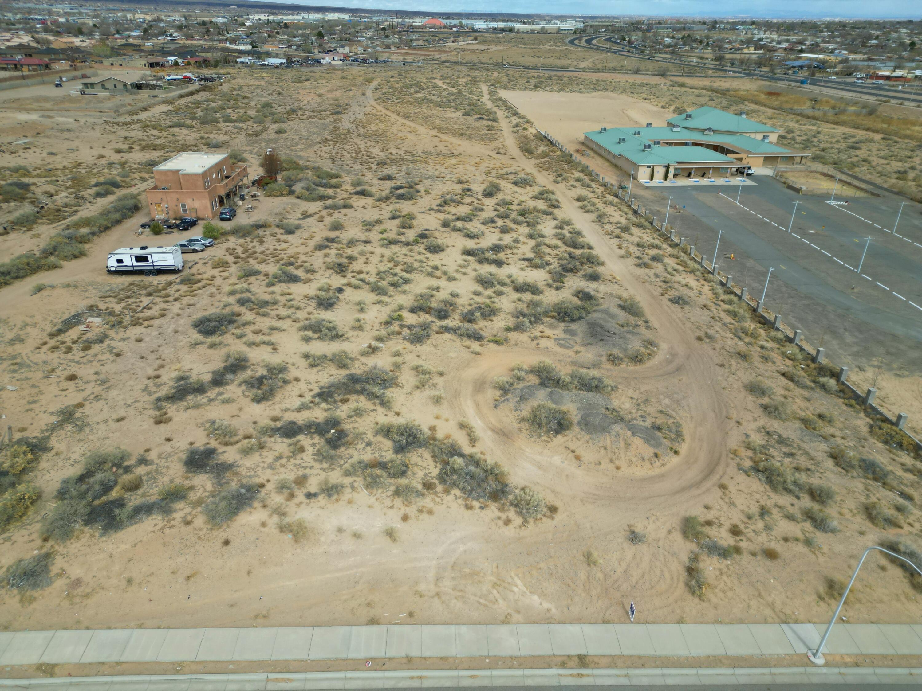 Prime 5 Acres of Land in Centralized Southwest Albuquerque! Unlock the potential of this exceptional 5-acre parcel.  This rare opportunity combines space, accessibility, and convenience, making it ideal for your dream home.  Utilities at the road including water, electricity, and sewer, providing an easy foundation for your vision. Just minutes from key amenities such as shopping centers, schools, parks, and major transportation routes.