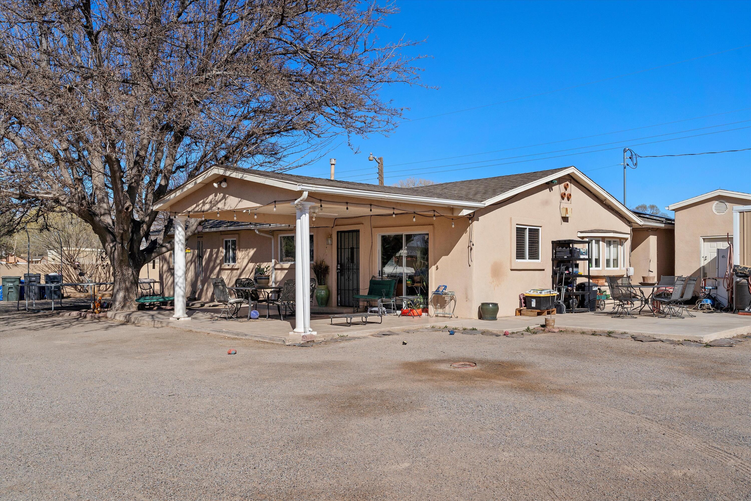 South Valley Gem! Situated on .5 acres this remodeled home has 4 bedrooms, 2 bathrooms, and TONS of room for all your toys. The primary suite features a large jetted bathtub and walk in steam shower. Nice large kitchen with stainless steel appliances. A pellet stove located in the primary suite. The building outside has a NEW A/C unit and NEW electricity.  A STORAGE BARN with TWO lofts stays with property. Located in a cul-de-sac with shops and restaurants minutes away. Completely walled in lot for your privacy, along with a NEW electronic gate for entry.  Move-in ready! This is a must-see!