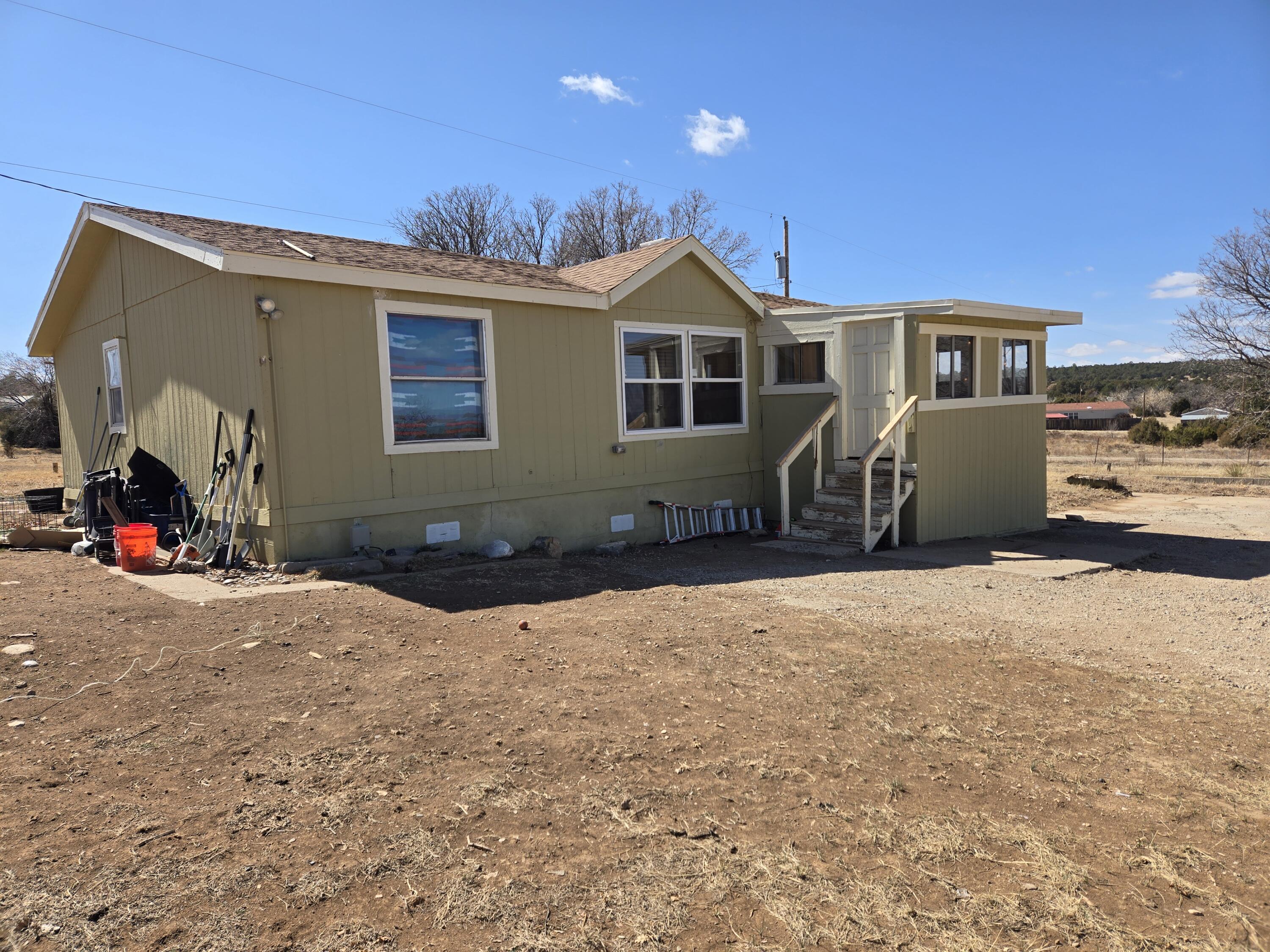 Affordable 3 bedroom with 2 full baths. Great views and privacy located in the Bearcat Subdivision. Property needs a few repairs and has great potential. A structural inspection was completed by Lindahl Construction in 2022 which he thinks included the porch as free-standing. The porch is not included in the square footage. Property is on the Bearcat Water Co-op. Not sure if power to laundry is propane or electric.