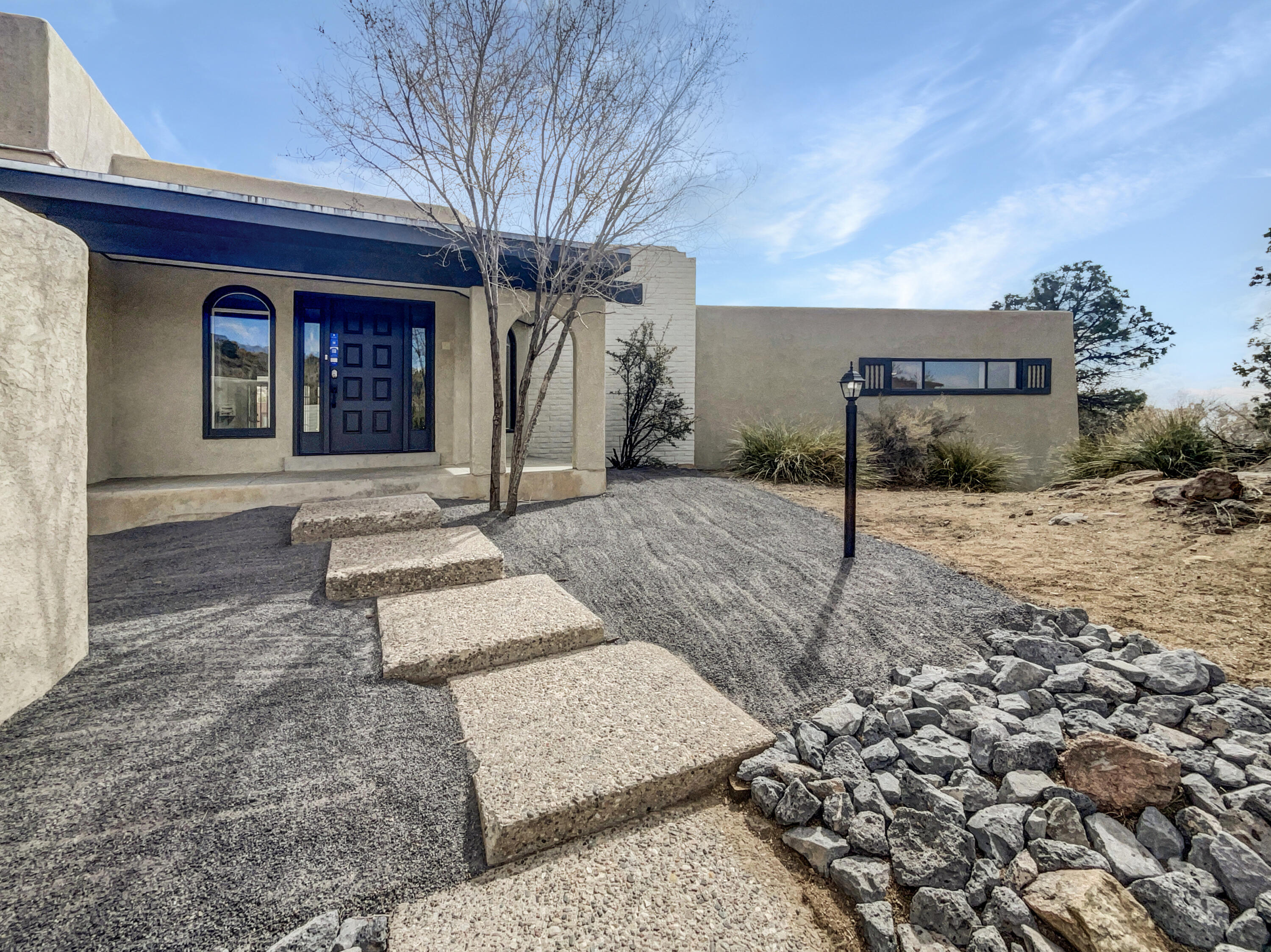 Welcome to this beautifully renovated home with gorgeous views and a brand new HVAC system! This charming property features a cozy fireplace, a soothing natural color palette, fresh interior and exterior paint and new flooring throughout. The remodeled kitchen boasts stone counter tops, a stylish backsplash and new stainless steel appliances. The primary bedroom has a walk-in closet, while the primary bathroom offers a separate tub and custom tile shower, double sinks and good under sink storage. Step outside to a nice deck, perfect for relaxing.  Don't miss out on this incredible opportunity!