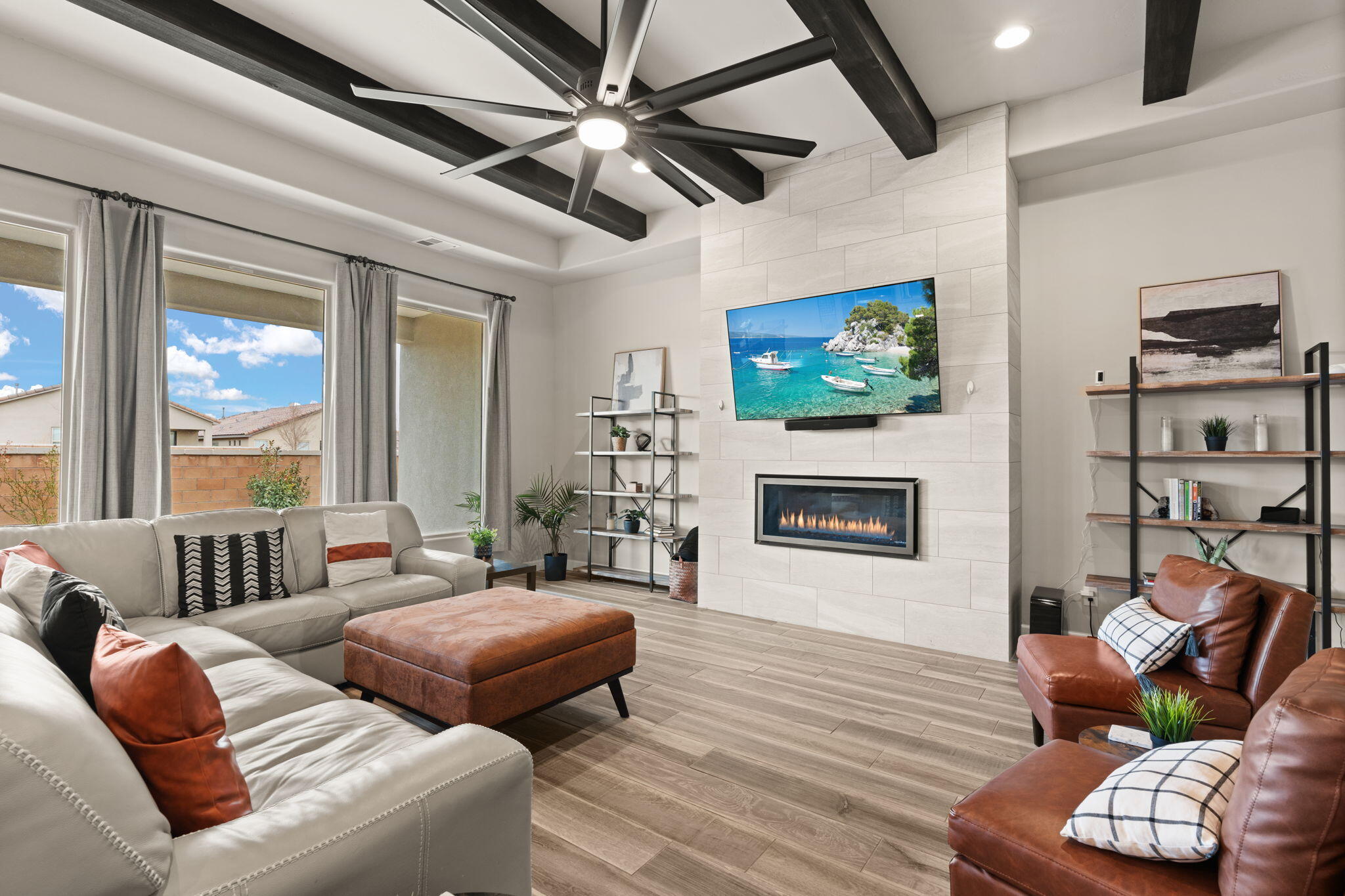 This stunning 5-bedroom, 3-bath home, built in 2022, offers modern living with a spacious open kitchen, ideal for entertaining. Natural light floods the home, highlighting the cozy fireplace and breathtaking mountain views. The master suite offers a walk-in closet, while additional bedrooms are generously sized. Enjoy the convenience of a 3-car tandem garage with EV charging and ample shelving for storage. The property features low-maintenance landscaping and is perfectly located near schools and walking paths, blending luxury and practicality. A true gem, book your showing today.