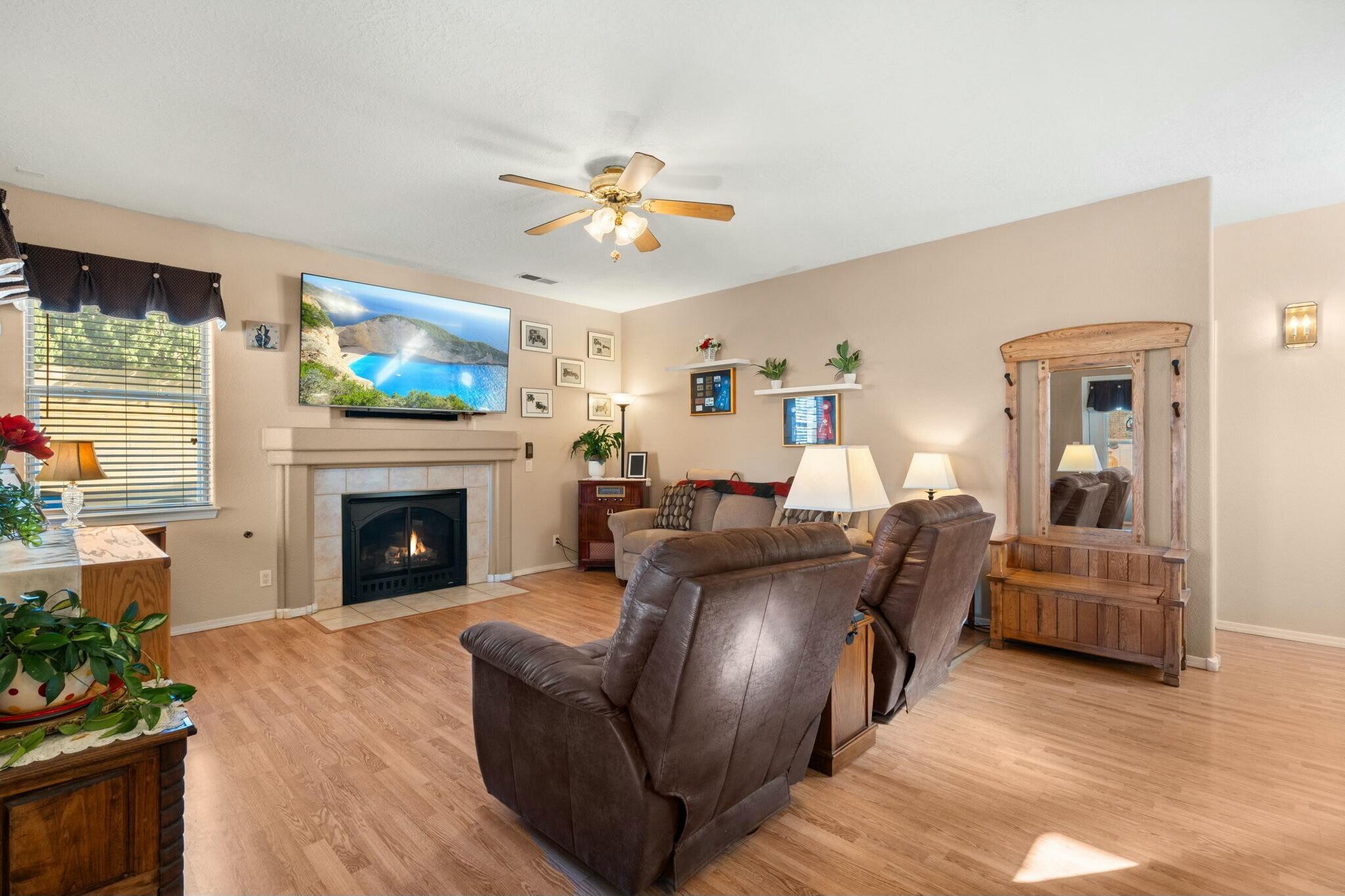 This charming one-owner home sits on an oversized corner lot with side yard access and RV parking plenty of space for all your toys! Inside, the chef's kitchen shines with a double oven, gas range, under-cabinet lighting and sleek granite countertops. The formal dining room is perfect for family meals, and laundry is conveniently located downstairs. With four spacious bedrooms, three bathrooms, and refrigerated air, comfort is key. One bedroom is conveniently located downstairs. Upstairs, you'll find three more rooms ready to serve your needs. The large master suite with double doors provides a private retreat. Two living areas provide ample space for everyone to unwind. The backyard is a true entertainer's dream. Don't miss out on this well maintained home. Don't miss out on this home.