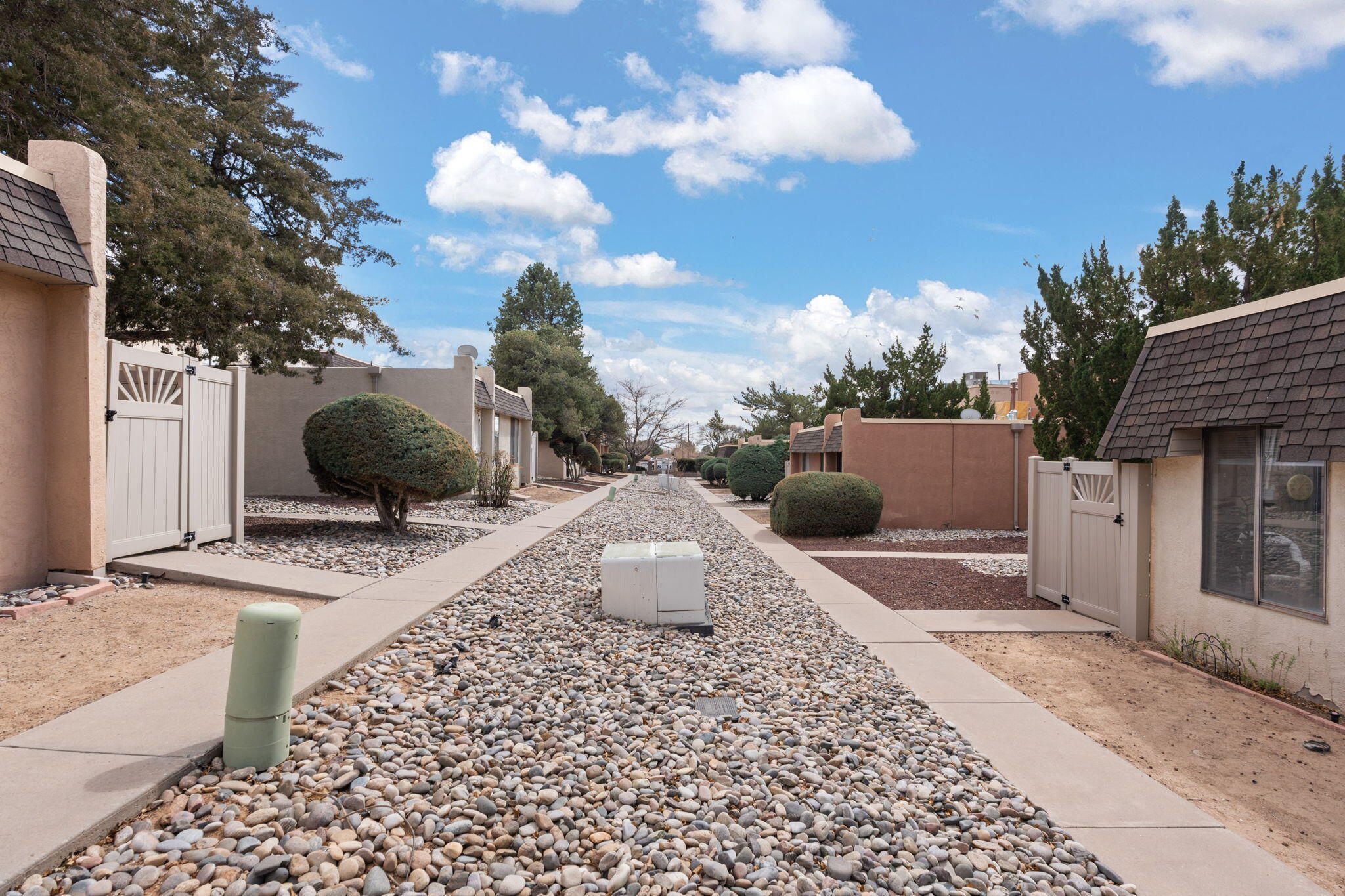 Discover this inviting ground-floor condo in NE Albuquerque, featuring fresh paint and new flooring throughout! Enjoy easy living with no stairs and a private enclosed patio, accessible from both the dining room and primary bedroom. The two bedrooms offer large closets for ample storage. Conveniently located just one block from multiple dining options, this move-in-ready home is perfect for convenient living. Don't miss this opportunity--schedule your showing today!