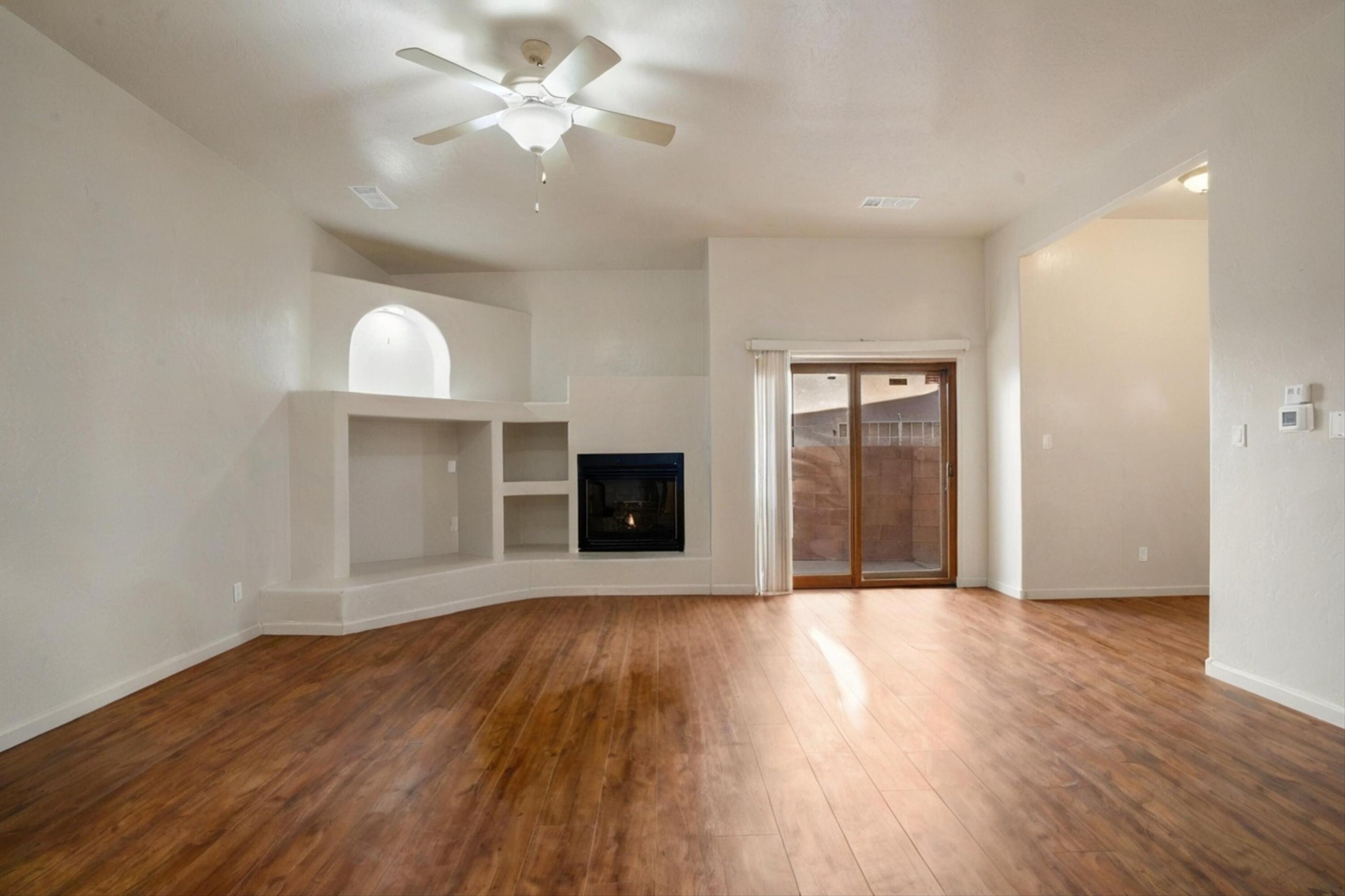 Welcome to 4908 Sun Cove Rd NE, where modern updates meet cozy charm in this beautifully renovated 2-bedroom, 2-bathroom townhome! With $61K in recent upgrades, this home is truly move-in ready. Step inside to find newer luxury vinyl flooring leading to a bright living space with a gas fireplace--perfect for cozy nights in. The modern kitchen shines with sleek GE stainless steel appliances (2024), granite countertops, and a gas stove, making it a dream for home chefs. Skylights in the kitchen, bathroom, and laundry area bathe the space in natural light. The primary suite offers a peaceful retreat with a walk-in closet and a stylish barn door. A fully remodeled second bathroom adds a fresh touch. Thoughtful details like newer baseboards, window screens, and updated hardware elevate