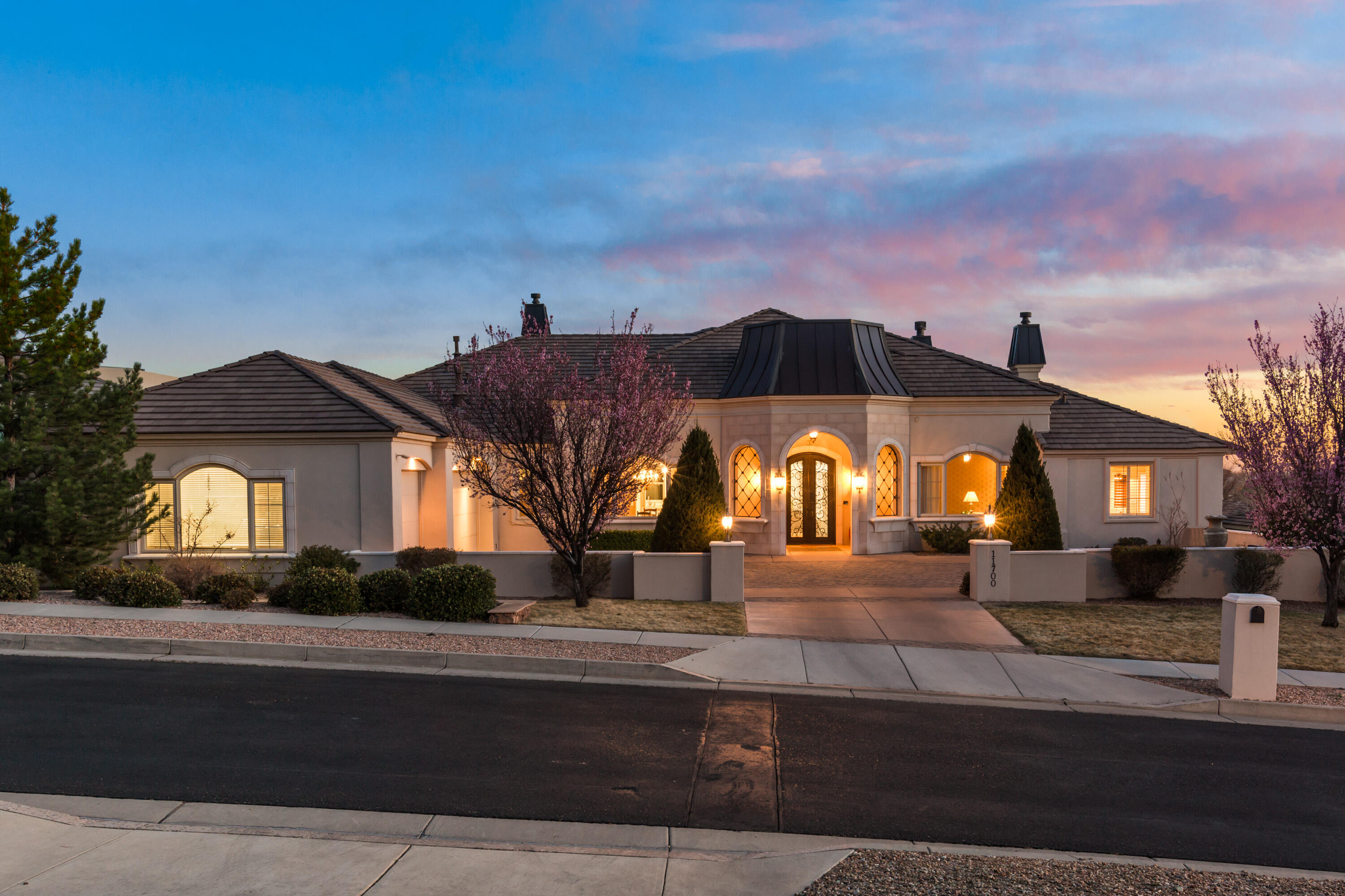 Located securely behind the gates in Sauvignon, and directly adjacent to the Tanoan Golf Course, lies an elegant French Country Estate. Classic old world finishes including hardwood floors, furniture grade cabinetry, rich granite, custom interior doors, beautiful light fixtures, hand forged iron railings, crown molding, and cast stone fireplaces define this great home. Grand in scale, yet comfortable and inviting, this home was designed for entertaining both small and large gatherings. There are both formal and informal living and dining areas as well as a game room, exercise room, theater, and office. Enjoy direct access from the community to the Tanoan Golf Course and country club. Enjoy the convenience of location with shopping, dining, entertainment, services, and trails nearby.