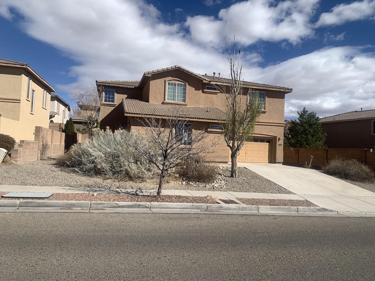 Open floor plan includes a primary bedroom with ensuite. Tile in entry and all wet areas. Kitchen has solid surface counter tops and breakfast nook. Fireplace in living area. Living area includes an attached Casita on main level (5th bedroom). See attached floor plan for layout. Gated front courtyard and walled back yard with covered patio.