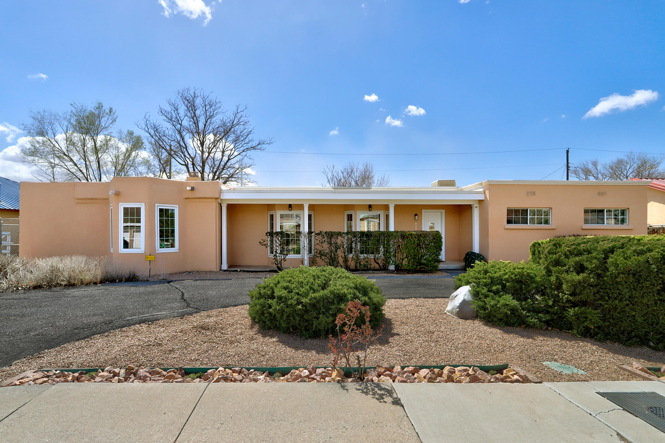 This special North Valley Nature Center neighborhood is calling  you home to this beautifully remodeled, spacious Territorial residence w/ 4 bedrooms, 3 baths & an additional bedroom & bath in the charming casita. The gourmet kitchen w/ quartz countertops, new appliances & kitchen island invites entertaining your family & friends.  This open, airy, light-filled floorplan flows from the front entry through the main living area into the great room that opens up through the sliding glass doors to the enormous covered patio.  Amenities include 2 living areas, 2 primary bedrooms & 2 additional bedrooms/office space.  There is an expansive exterior w/ 2 raised beds for your organic gardening & a workshop/storage building. Close to Old Town, downtown, hiking & bike trails & the Rio Grande river.