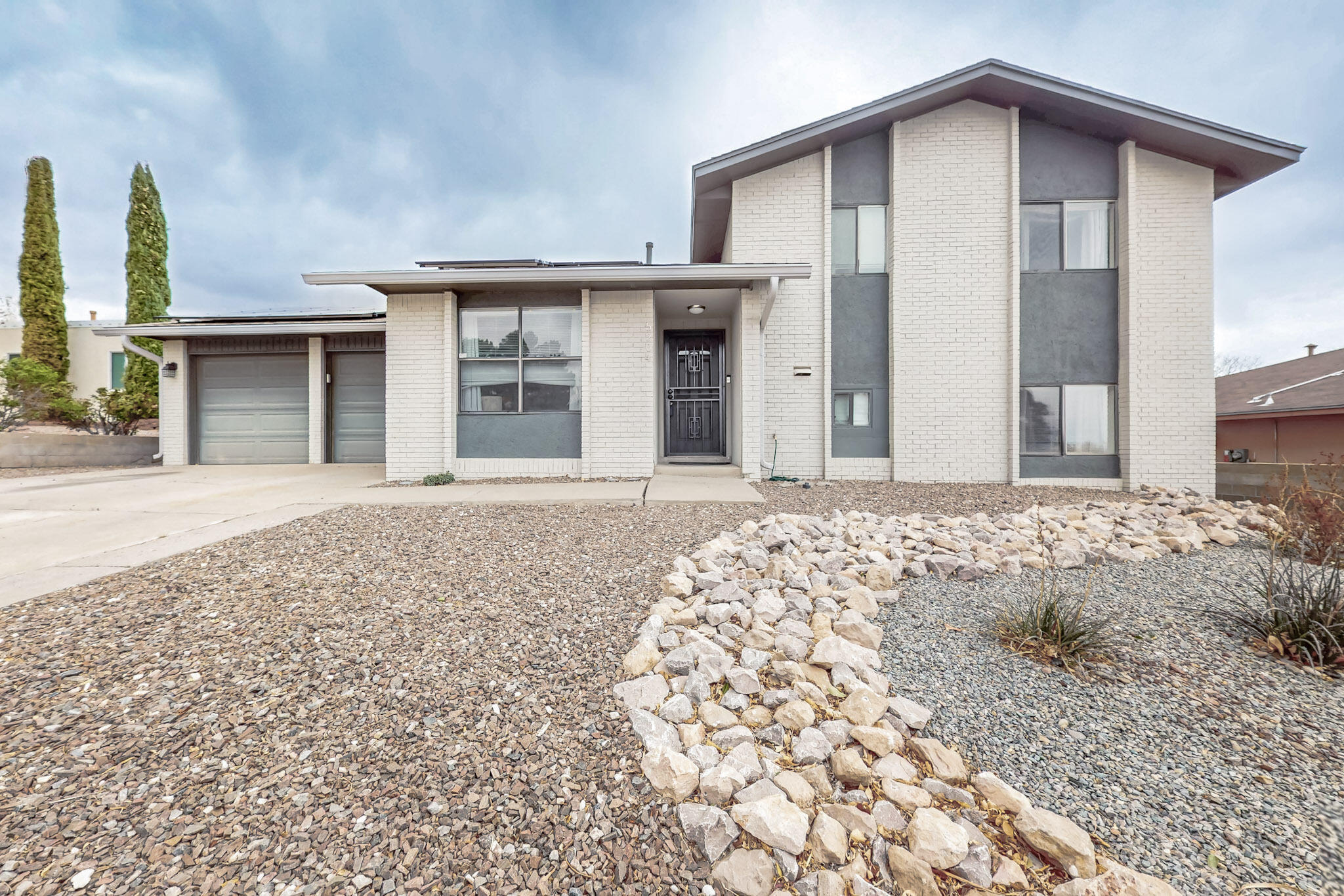 This split level, 4 bedroom, 2 bathroom home, with two living areas is right in the heart of Taylor Ranch. New refrigerated air 2023! With beautiful upgrades. You'll find granite counter tops in the kitchen, stainless steel appliances that with stay with the home, recessed lighting, pantry, and modern tile flooring throughout the main level. Washer and dryer will stay!! Large back yard with covered patio is perfect for entertaining for your upcoming summer party's. Outdoor shed stays. Solar panels are paid off! No loan to assume!
