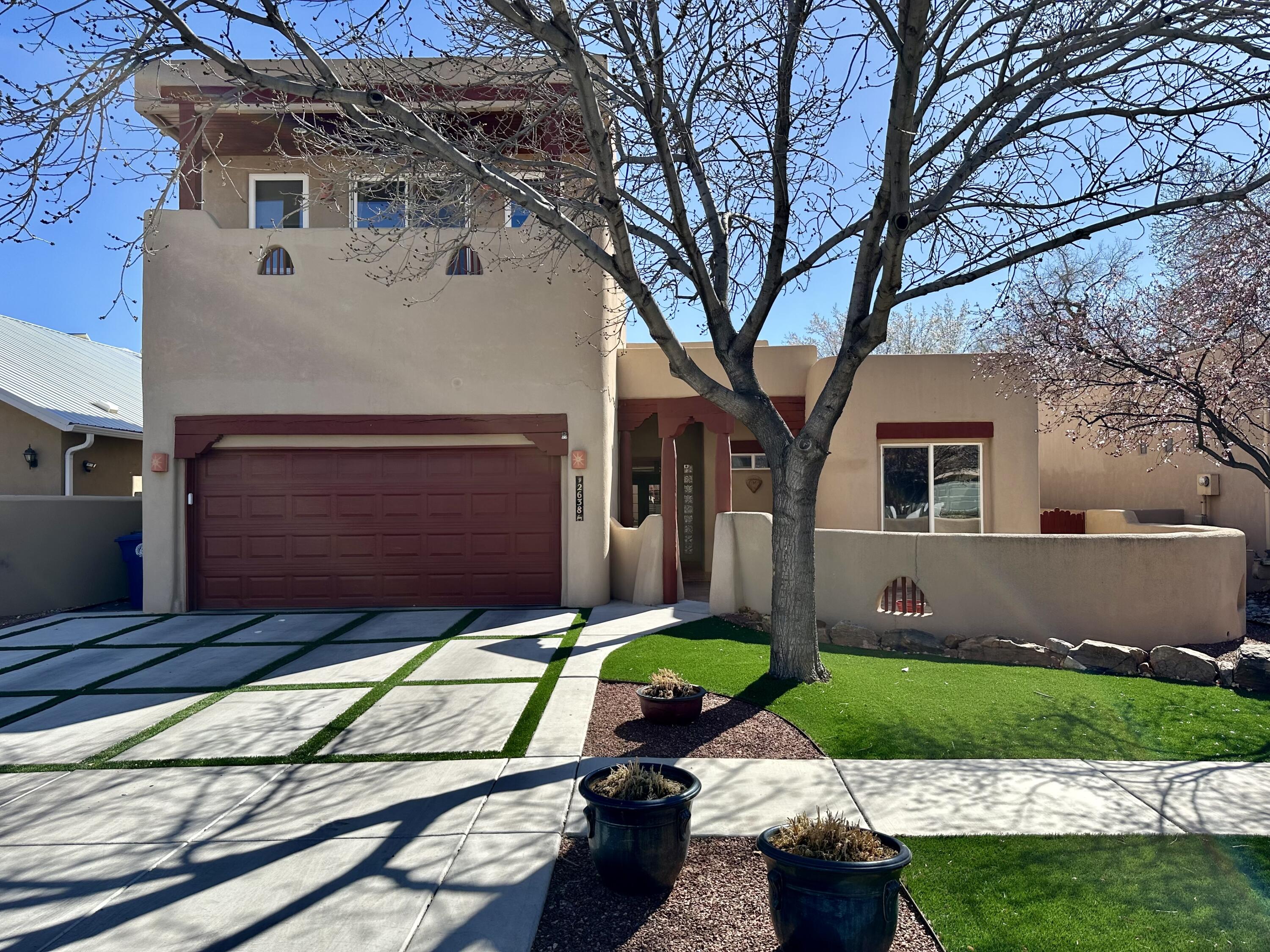 Cottonwood lined streets welcome you home in a gated community just minutes from Old town, The ABQ Bio Park, Zoo and downtown. This beauty features high ceilings, open floor plan and custom features throughout. Saltillo tiles, hand carved posts, vigas & corbels bring a touch of southwestern sophistication. Three bedrooms on the main floor, including the primary with a gas kiva fireplace, a full on-suite bathroom double sinks, and two closets. The front bedroom has its own entry door to the front courtyard. The backyard features a covered gazebo, putting green and raised garden beds.
