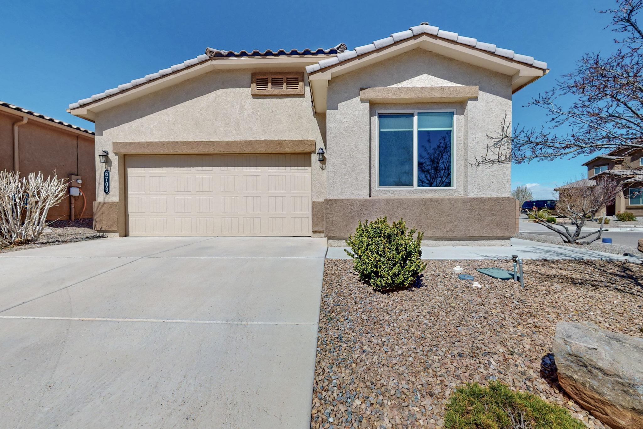Spacious Lot with Views! This well-maintained home offers 3 bedrooms, 2 baths, and a 2-car garage. The open-concept layout features a granite kitchen island that flows into the dining and living areas, complemented by a stainless gas range, microwave,  dishwasher, and a self-cleaning oven. The owner's suite is privately positioned at the rear, boasting a large walk-in shower, separate soaking tub, and dual vanities. Upgraded wood shelving throughout adds a refined touch. Enjoy the covered patio and an extra-deep, walled, and gated backyard. Energy-efficient Green Build Certified with refrigerated air, a tankless water heater, 2x6 exterior construction, and a durable concrete tile roof. Don't miss this move-in-ready home!