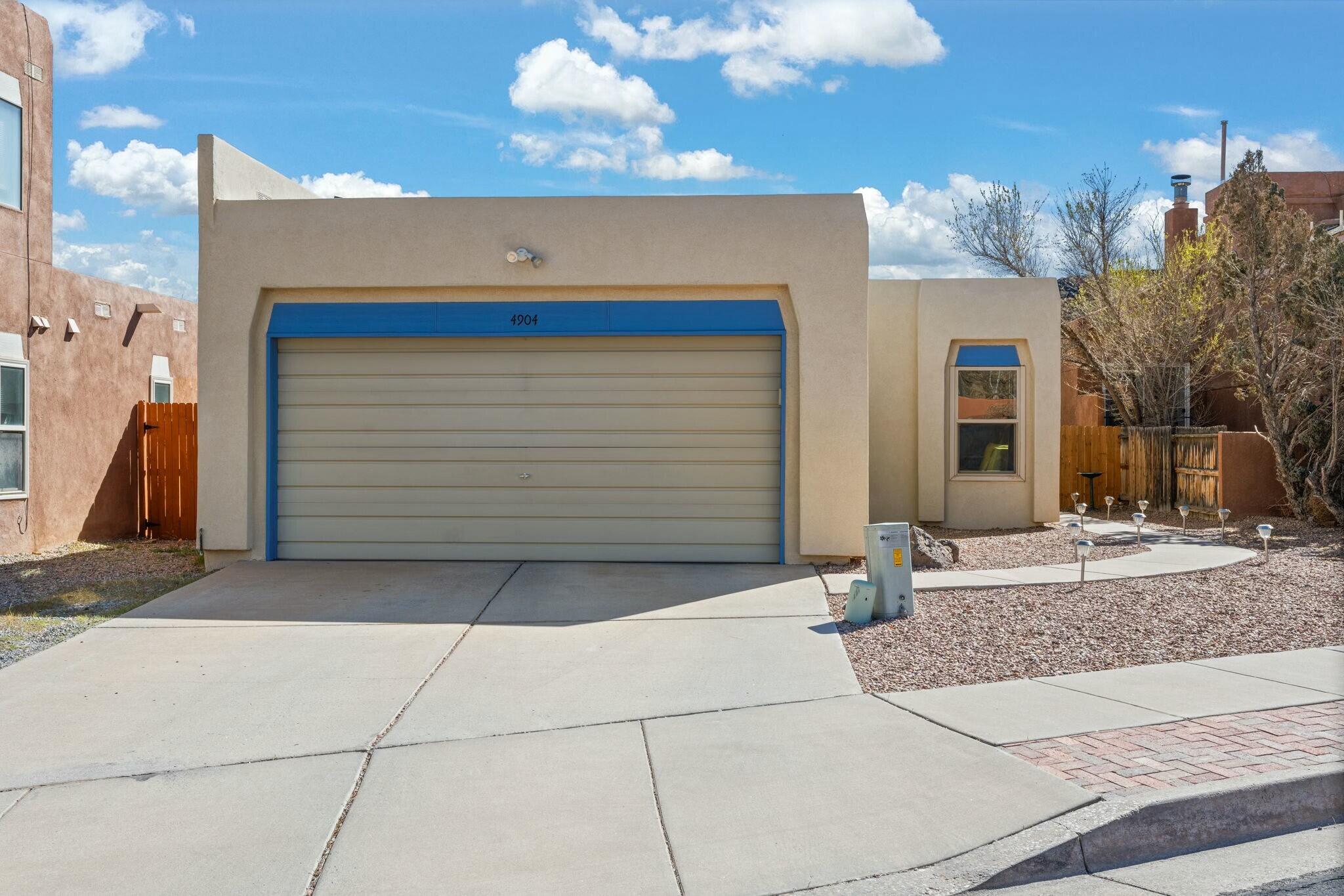 Step into the perfect blend of style and serenity! This stylish home offers a bright, open layout with beautiful natural light and modern finishes throughout. The 2022 TPO roof comes with a five-year warranty, and recent updates include Pella windows and refreshed stucco. The kitchen is a showstopper with sleek countertops, light maple cabinetry, a striking green accent wall, and a hexagonal tile backsplash. Outside, unwind in a private backyard retreat featuring a cozy fire pit, charming string lights, and breathtaking views of the natural lava rock landscape. Enjoy nearby amenities and entertainment such as Petroglyph monument, Mariposa Park, Flix Brewhouse, Bosque trails and a multitude of restraints and shopping.