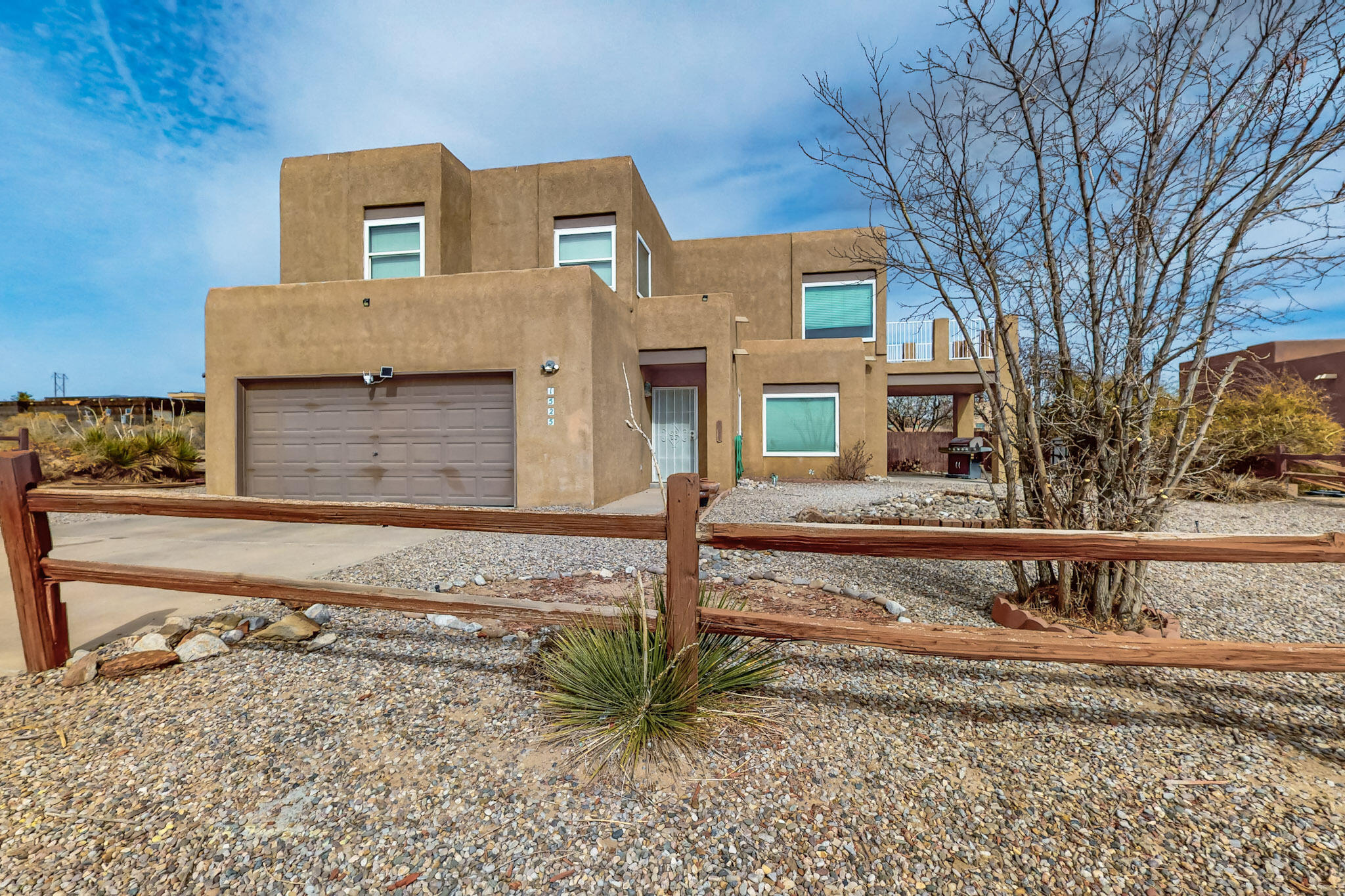$5000 Seller concession towards Buyers closing costs, prepaids or rate buy down! Stunning house nestled in a quiet cul-de-sac, this warm & inviting property offers spacious living areas, modern amenities, & spectacular Sandia Mountain views. Highlights are open floor plan filled with natural light, high ceilings, & a cozy fireplace. Kitchen boasts ample counter space, quality cabinetry, & a charming breakfast nook with mountain views. The spacious primary suite offers a spa-like en-suite with dual sinks, a soaking tub, & a separate shower. Additional bedrooms provide comfort and flexibility for family, guests, or a home office. Enjoy breathtaking sunsets from the 1/2 acre private backyard with a spacious patio, perfect for outdoor dining and relaxation. Low-maintenance desert lands