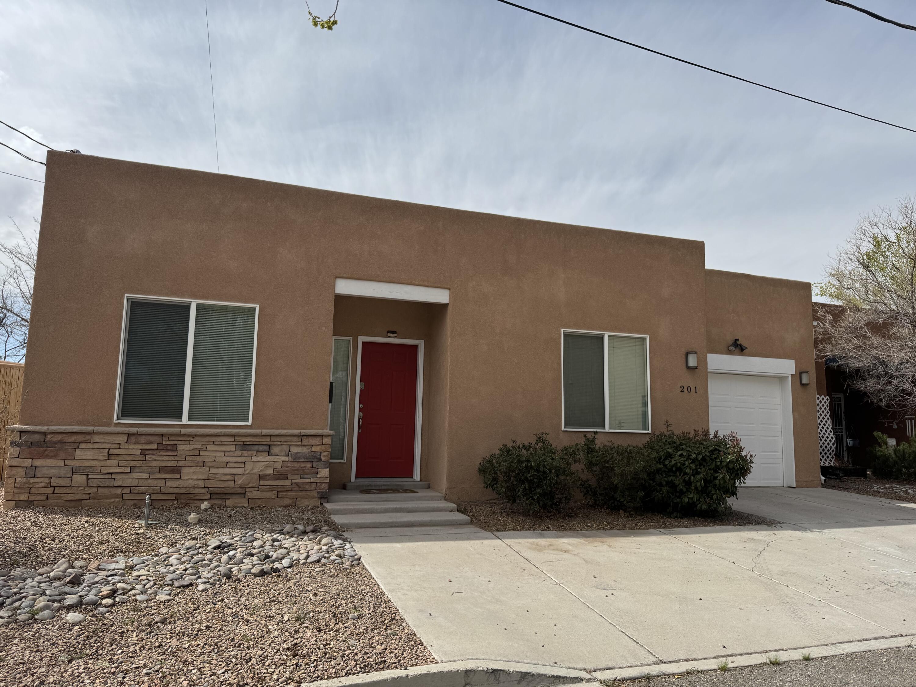 Great location near Downtown Albuquerque, This charming nicely updated single family home comes completely upgraded with two luxurious and modern bathrooms, and two bedrooms on opposite sides for privacy. This home is in a desirable location between Downtown, Albuquerque and Old Town. Nestled in the prestigious location minutes from the Albuquerque Country Club, Tingley Beach, ABQ Biopark and endless options for dining, shopping and access to downtown businesses. The floor plan is flexible, with one bedroomfunctioning as an office or bedroom, and an open  kitchen, dining and living room. Enjoy the oversized backyard ideal for outdoor entertaining.