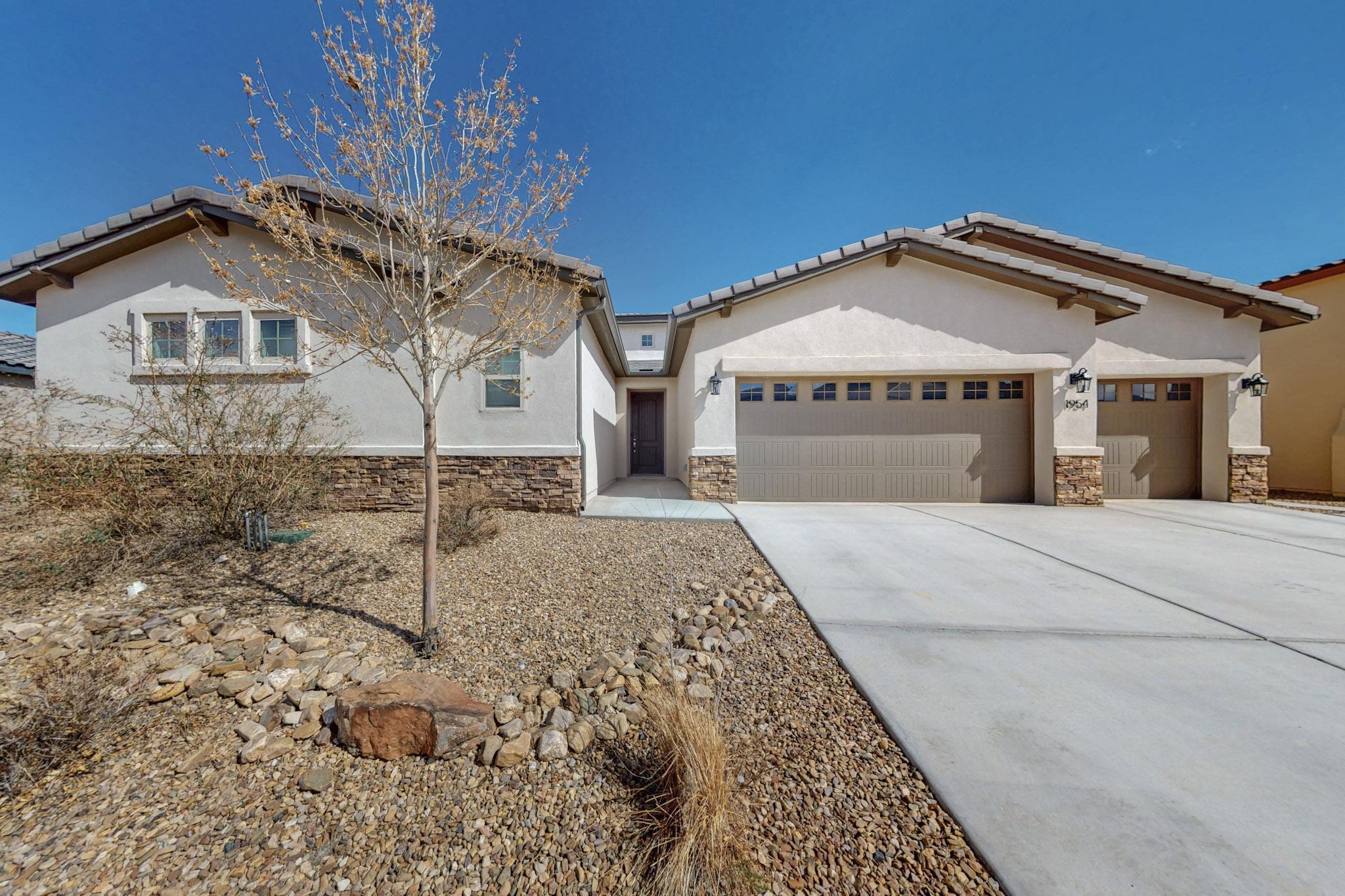 This stunning single-story home in the gated Mariposa community offers double primary bedrooms or perfect for an in-law suite with a private sitting room, mini fridge, full bath and large walk-in closet with its own washer/dryer. Energy-efficient, the home features a spacious open-concept kitchen with ample cabinets, a huge island, and stainless steel appliances. Two large sliding doors open to a shaded patio with beautiful views. The luxurious private primary bedroom offers a serene retreat. The finished 3-car garage is equipped with a 220 plug. Enjoy community amenities such as a center, park, pool, and more. Conveniently located just 10 minutes from the city center, shopping, and dining off HWY 550.