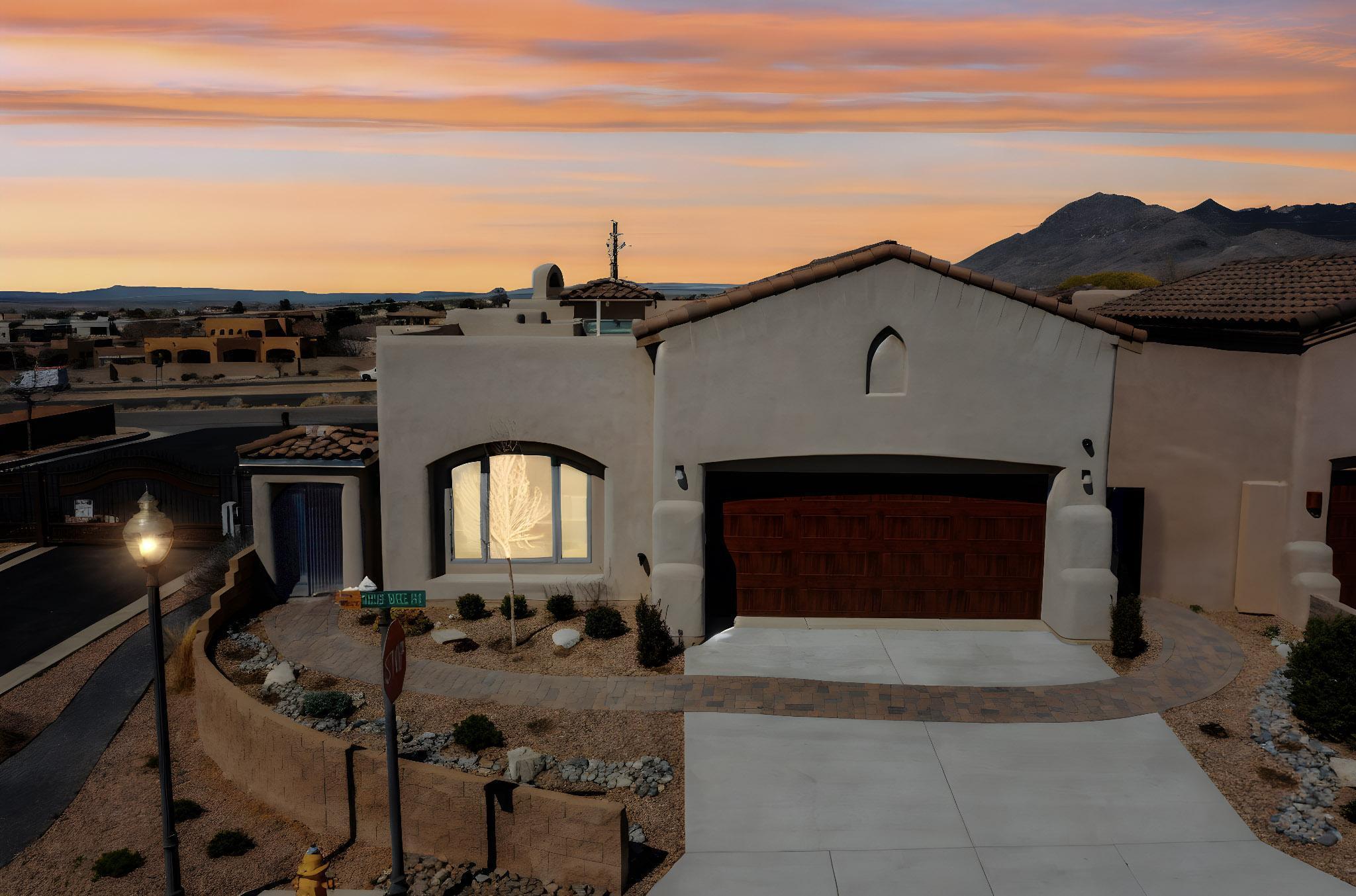 Stunning Custom Panorama Beauty! Sandia Views!! Located in the sought after Cielo Estates gated community & the La Cueva School District, this Energy Efficicient Smart Home is dazzling with custom features to include: Energy efficient oversized Kolbe windows. 12' high ceilings in the LR, dining, open floorplan, natural light. Gorgeous Select Maple Wood flooring throughout, beautiful marble terrazzo tile , Quartz countertops and Custom cabinetry, Separate  laundry room and garage shop area with 3 220 outlets! Alarm system, gas fireplace, Large chef pantry, 8 ft. Select Alder hand-made doors,  ERV Air Filter System, Water filter/softener system, Hugh attic above the garage, large stand alone cast iron tub, huge walk in shower , heated floors & towel bars, beautiful landscape with Pavers