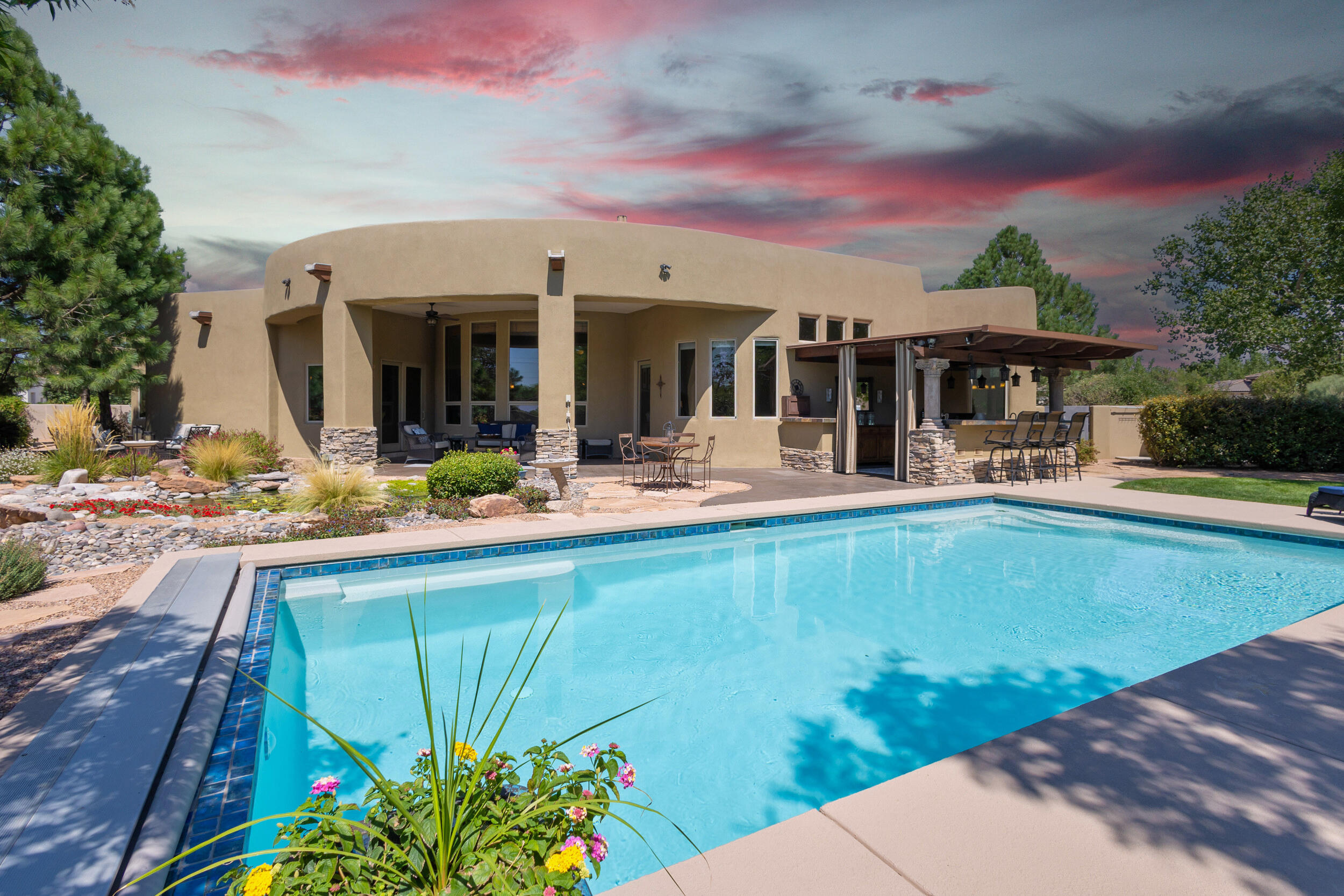 OPEN HOUSE SAT May 10, 1:30-3:30. REDUCED PRICE!  Gated luxury community of Bona Terra.  Enjoy resort living: solar heated gunite pool w electric cover, cabana, grilling station, bar seating for 8, water feature, water well to landscape; super convenient walking trails, shops & restaurants. TWO large Primary En-Suites in private wings: luxurious bathrooms & walk-in closets.  Chef's kitchen: Viking gas range & double ovens, 2024 Viking Microwave, 2025 built-in frig, 2 sinks, granite, pantry. Enjoy movies & sports in your Theater Room!  Exquisite features: Pella windows, diamond plaster walls, travertine tile, wood floors, wood beam ceilings; wet bar, wine frig; wired sound inside & out; radiant heat; recent Heat/AC Combo Units; TPO roof with warranty; synthetic stucco.  MORE: