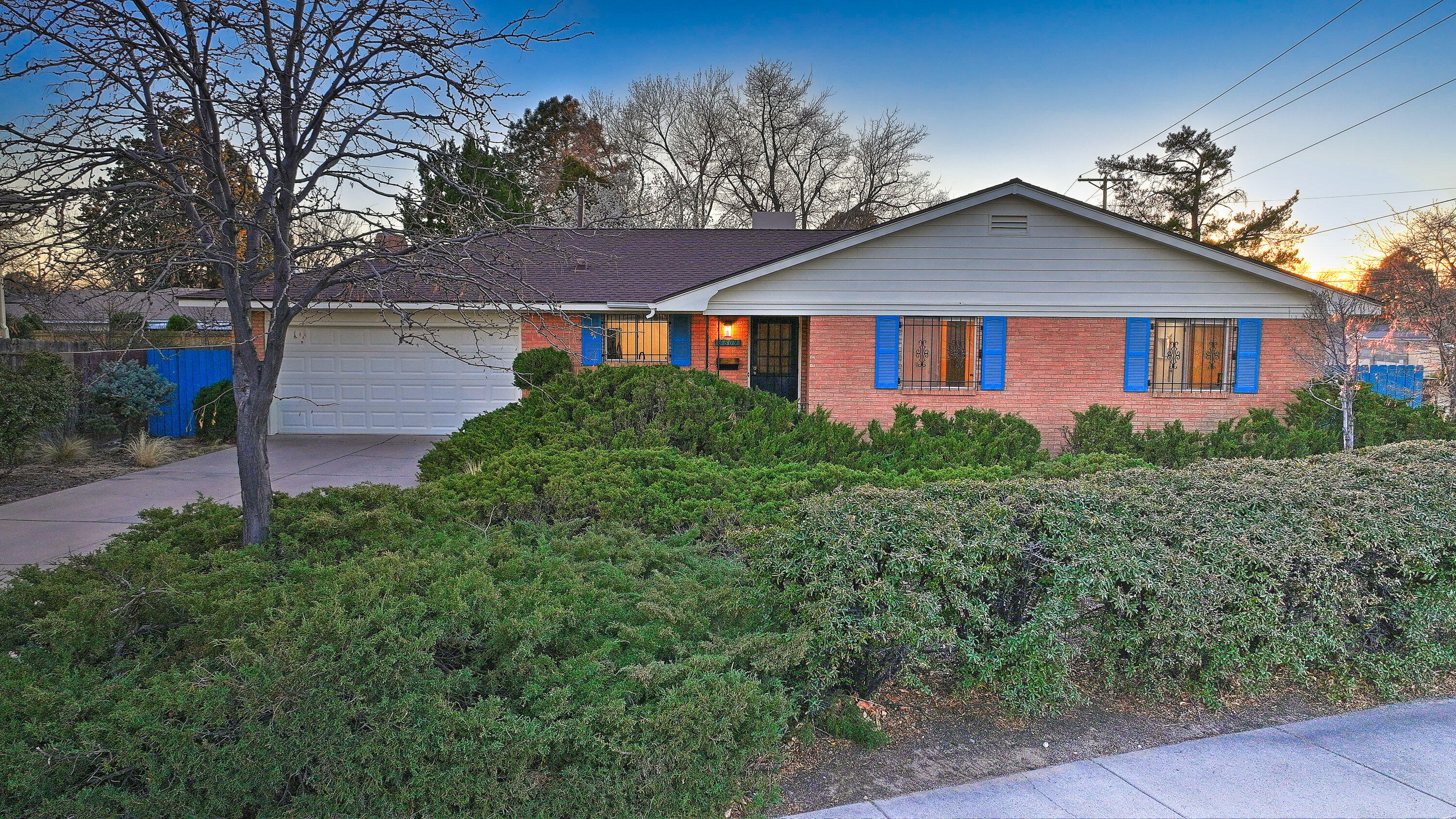 Step inside this elegant Mossman beauty which boasts hardwood floors that flow seamlessly throughout the home. Pride of ownership is evident with the newly renovated bathrooms, fresh paint, two living areas and a dining room as well as kitchen nook. The popcorn ceilings have also been removed.  Stunning views of the Sandia mountains enhance it's appeal. This all brick home features a covered back porch and a spacious backyard. Perfect for entertaining. Book your showing today!