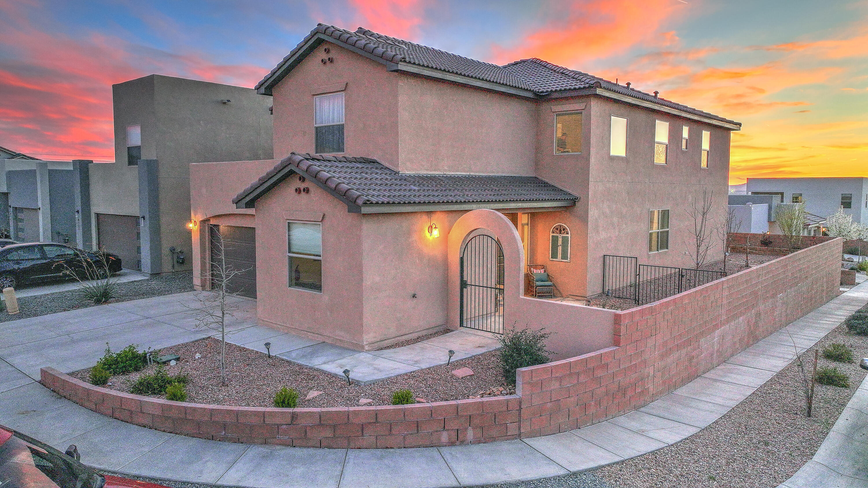 Welcome to your dream home! This exquisite luxury residence blends sophistication and comfort with stunning wood plank tile and a modern staircase. The chef's kitchen features quartz counters, oversized island with bar seating, a 6-burner gas cooktop, pot filler, and ample storage. A guest suite with full bath and a separate office or 5th bedroom are on the main floor. Upstairs, a spacious loft offers sweeping city and mountain views. The owner's suite boasts a spa-like bath with soaking tub, dual vanities, huge walk-in closet, and private deck to enjoy sunsets and balloons. Located in a gated community near I-25, with shopping and dining just moments away.